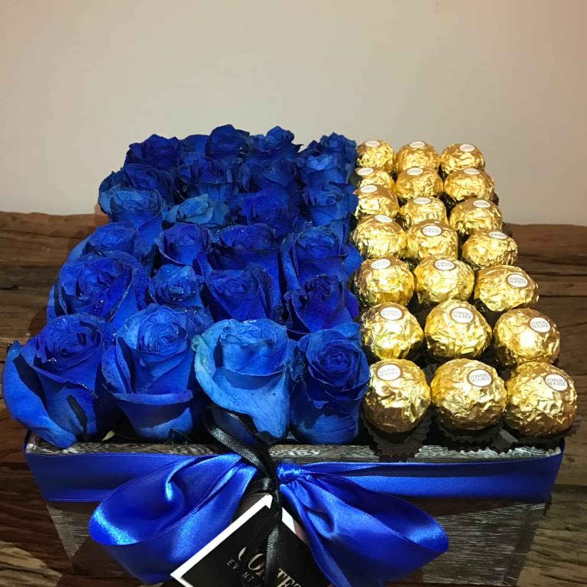 Delightful box featuring stunning blue roses paired with luxurious Ferrero Rocher chocolates.