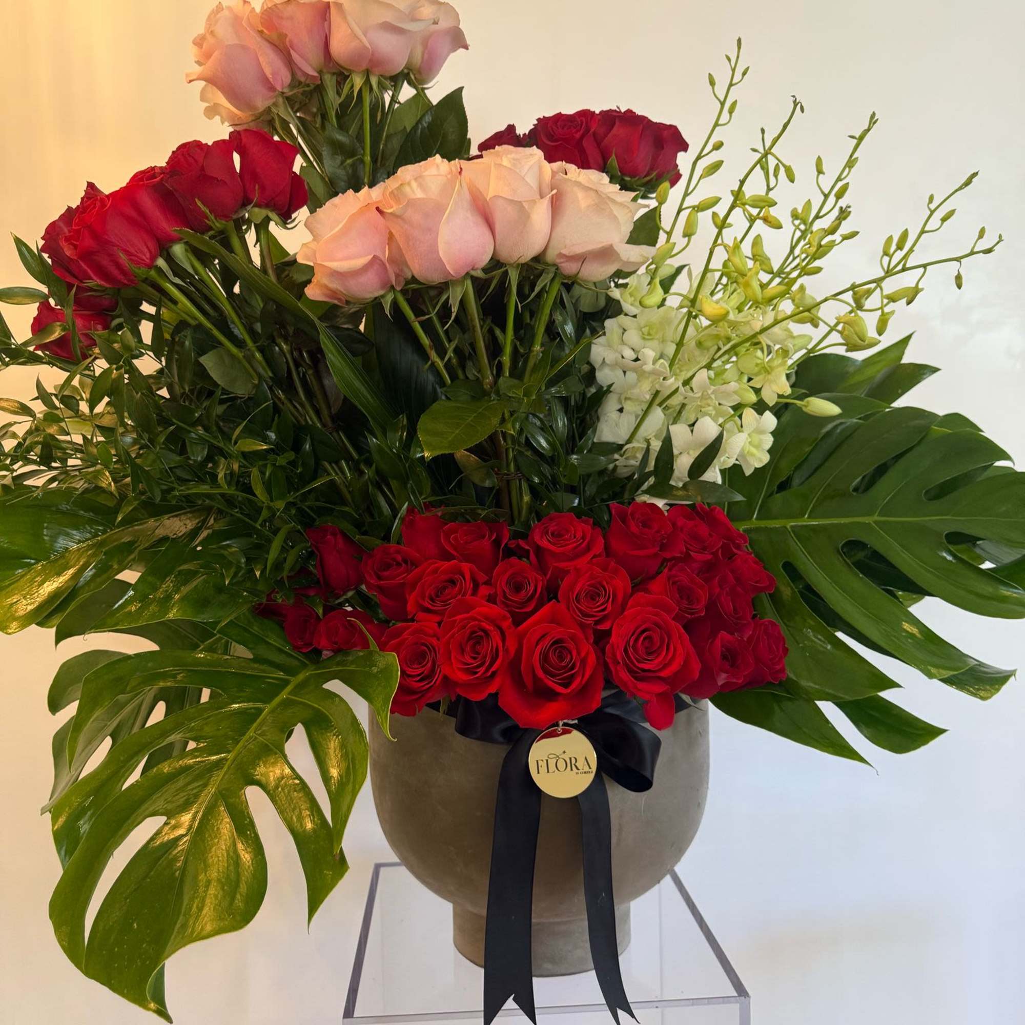 Experience the magic of beauty with our Enchanted Bloom Arrangement, a breathtaking
