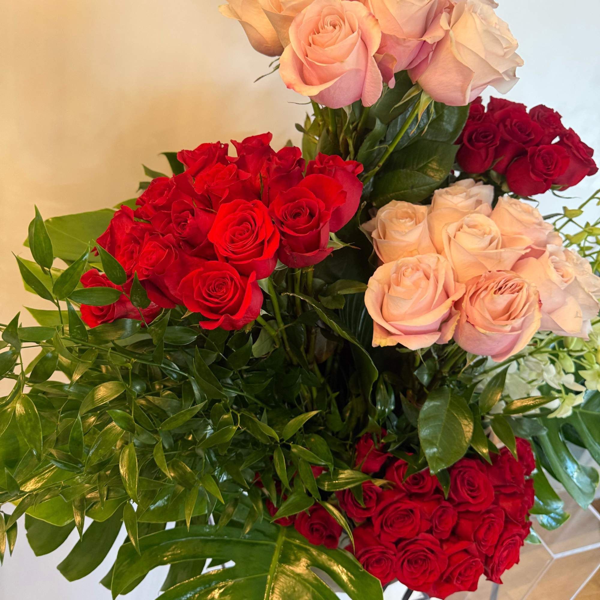 Experience the magic of beauty with our Enchanted Bloom Arrangement, a breathtaking