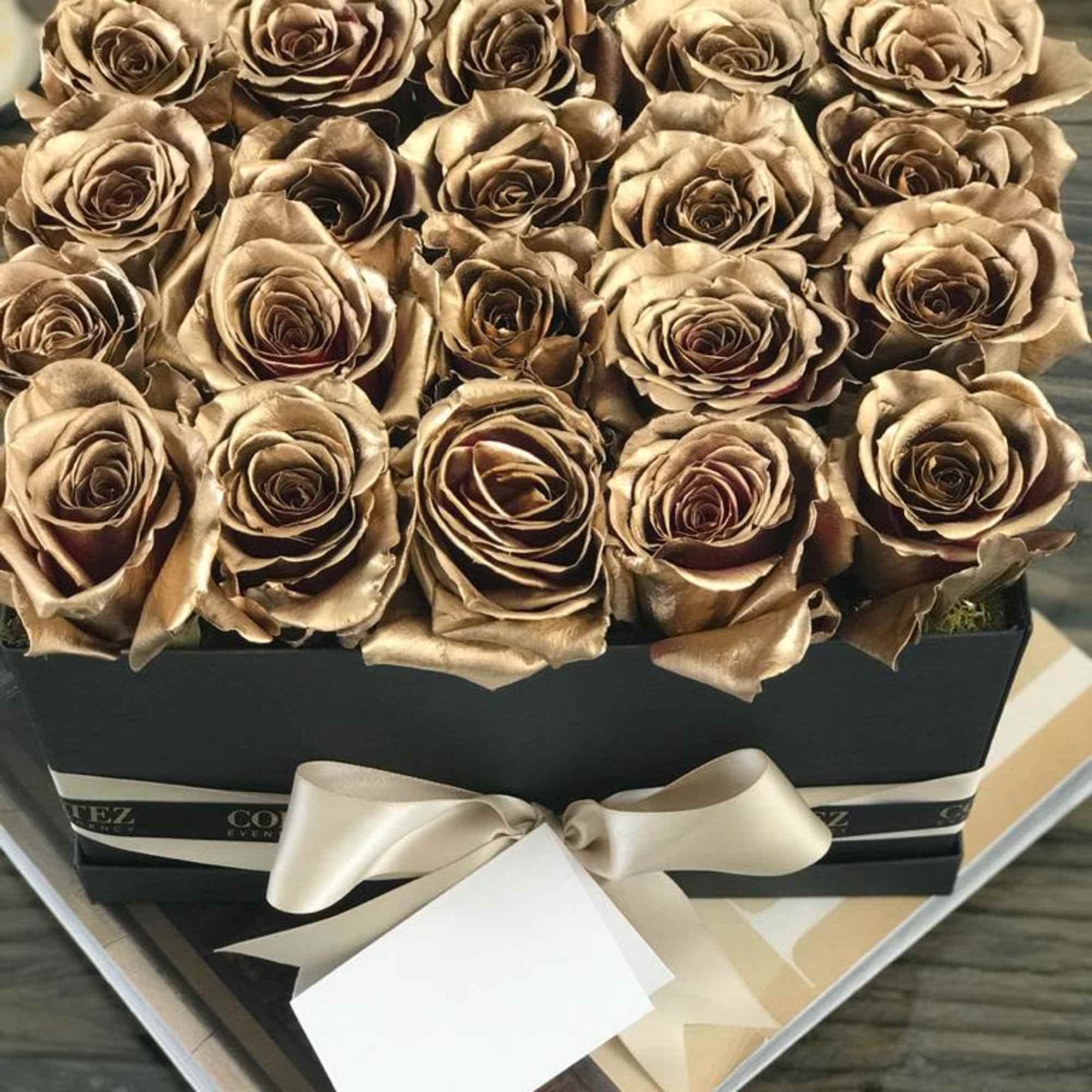 Elegant box filled with approximately 20 gold roses, offering a luxurious and