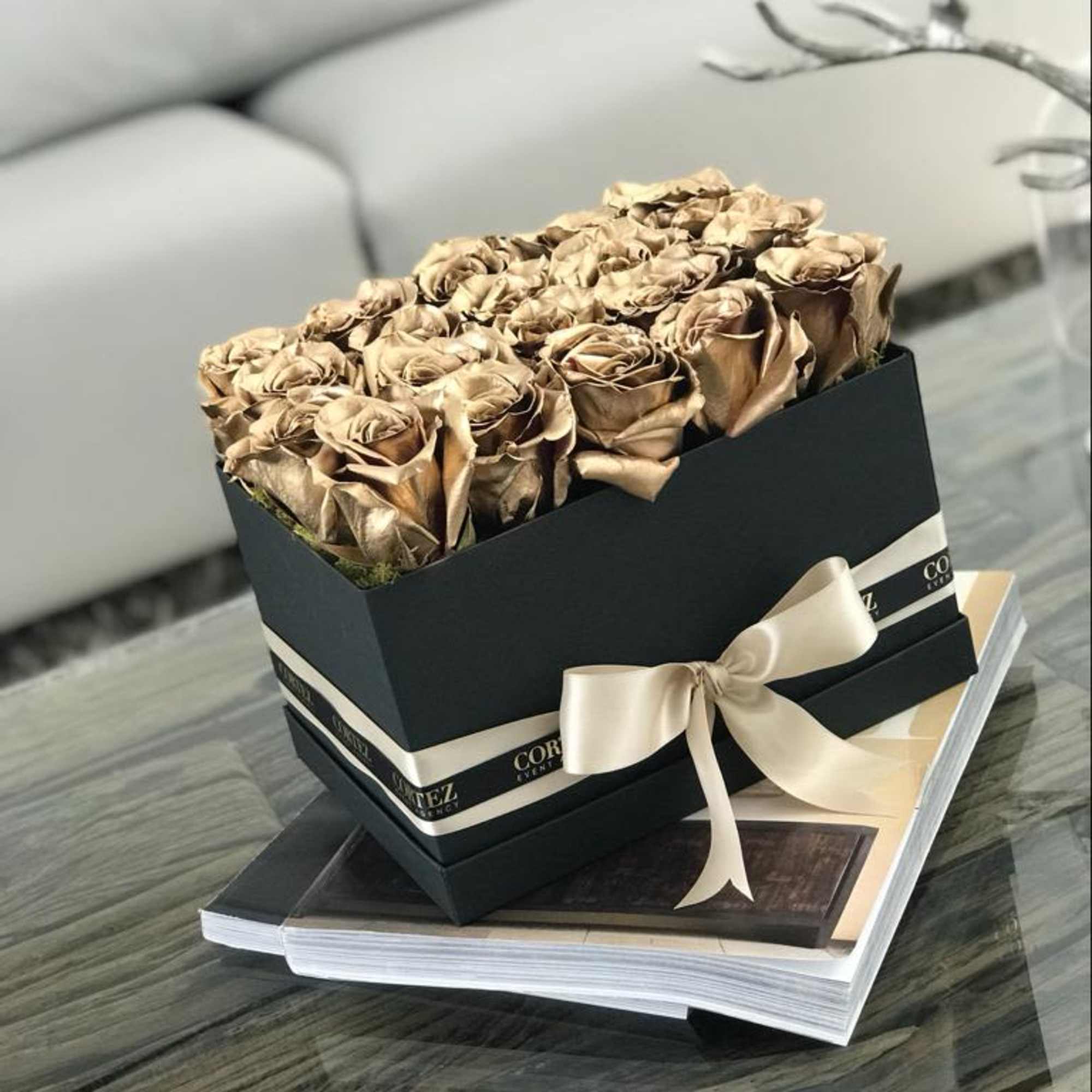 Elegant box filled with approximately 20 gold roses, offering a luxurious and