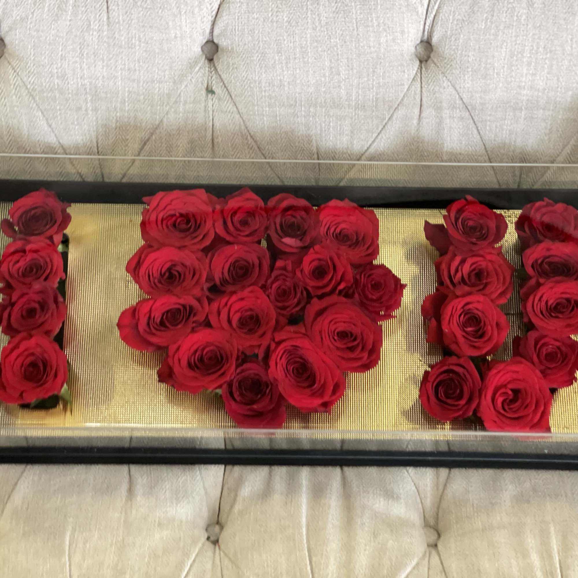 Unique and heartfelt arrangement of roses spelling 'I LOVE U' in a