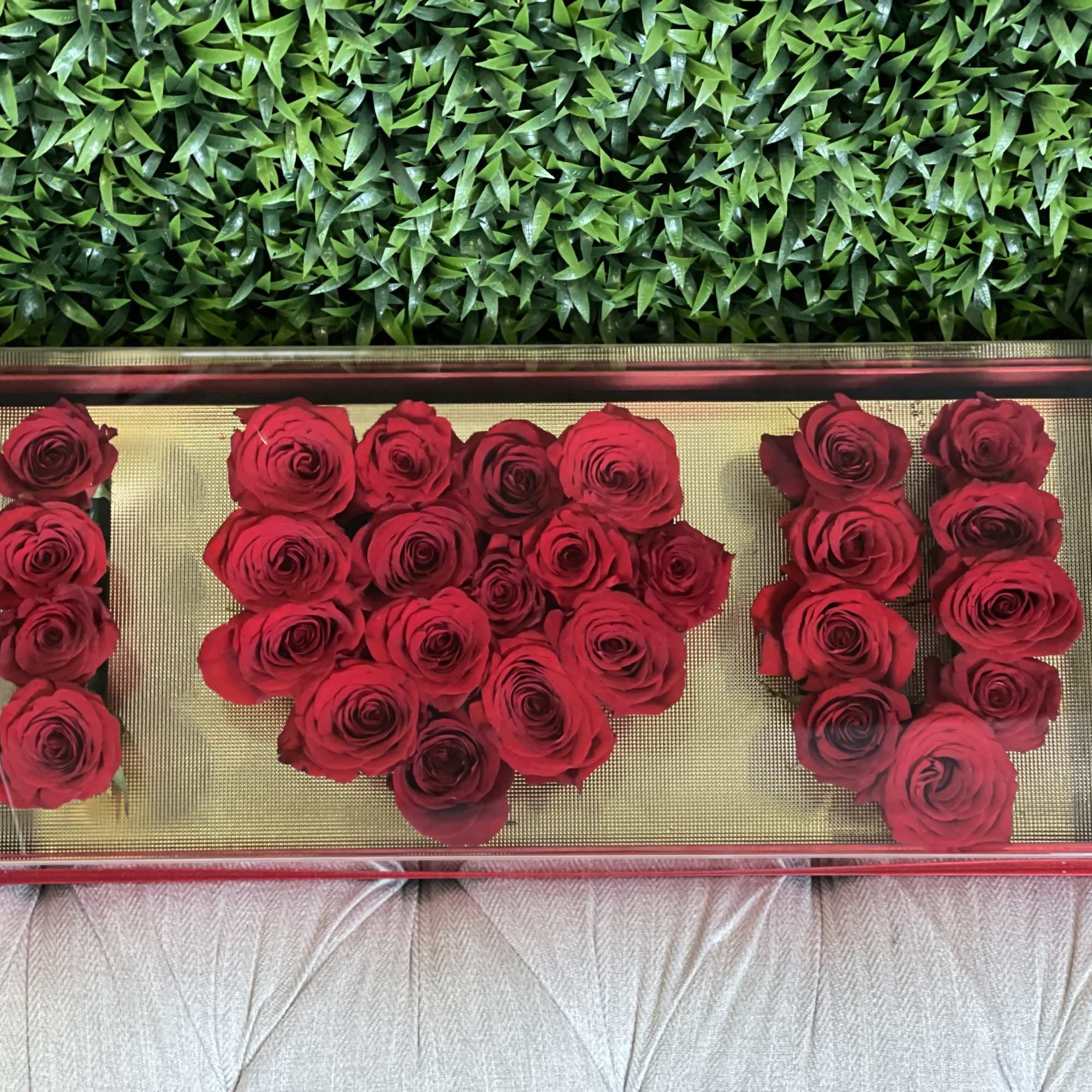 Unique and heartfelt arrangement of roses spelling 'I LOVE U' in a