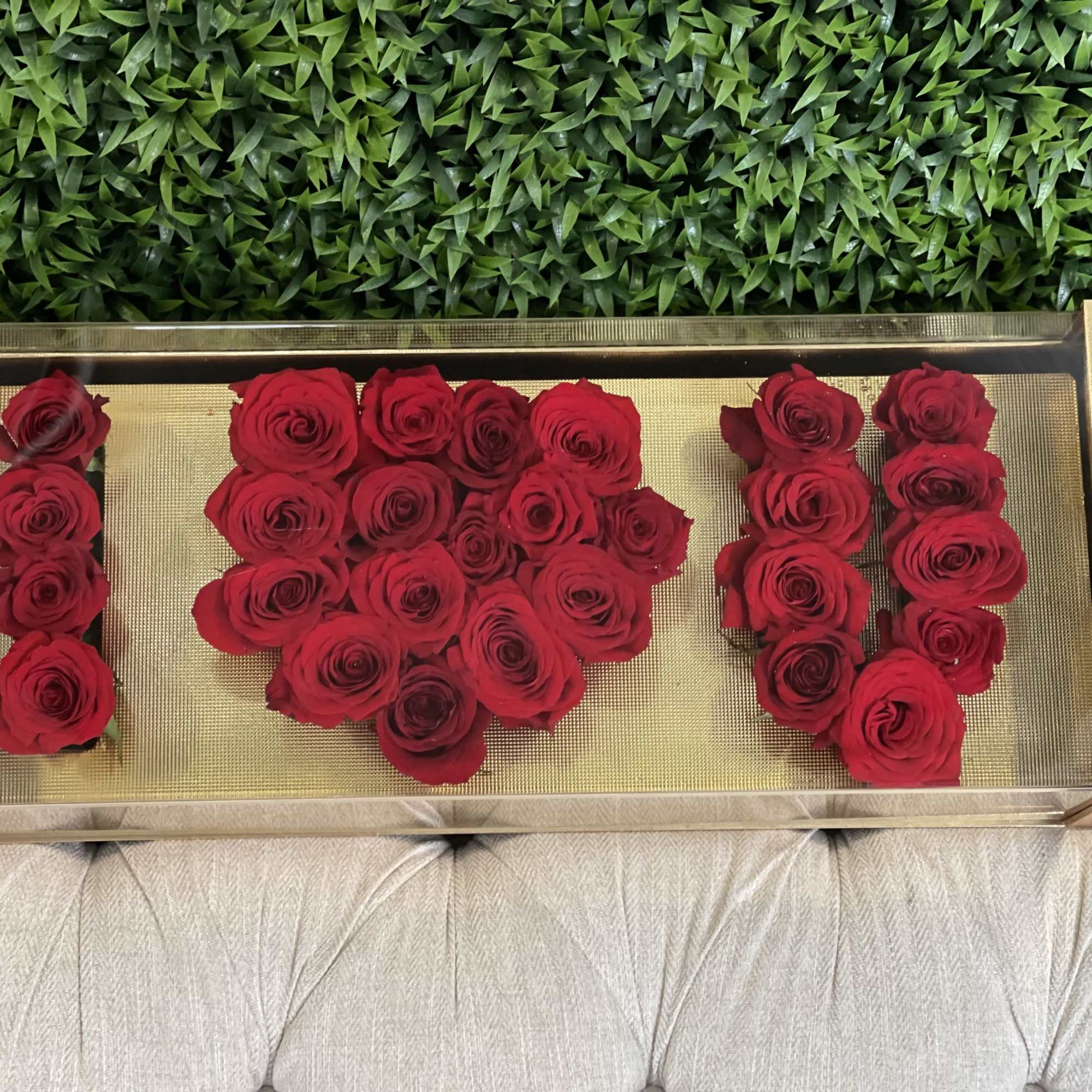 Unique and heartfelt arrangement of roses spelling 'I LOVE U' in a