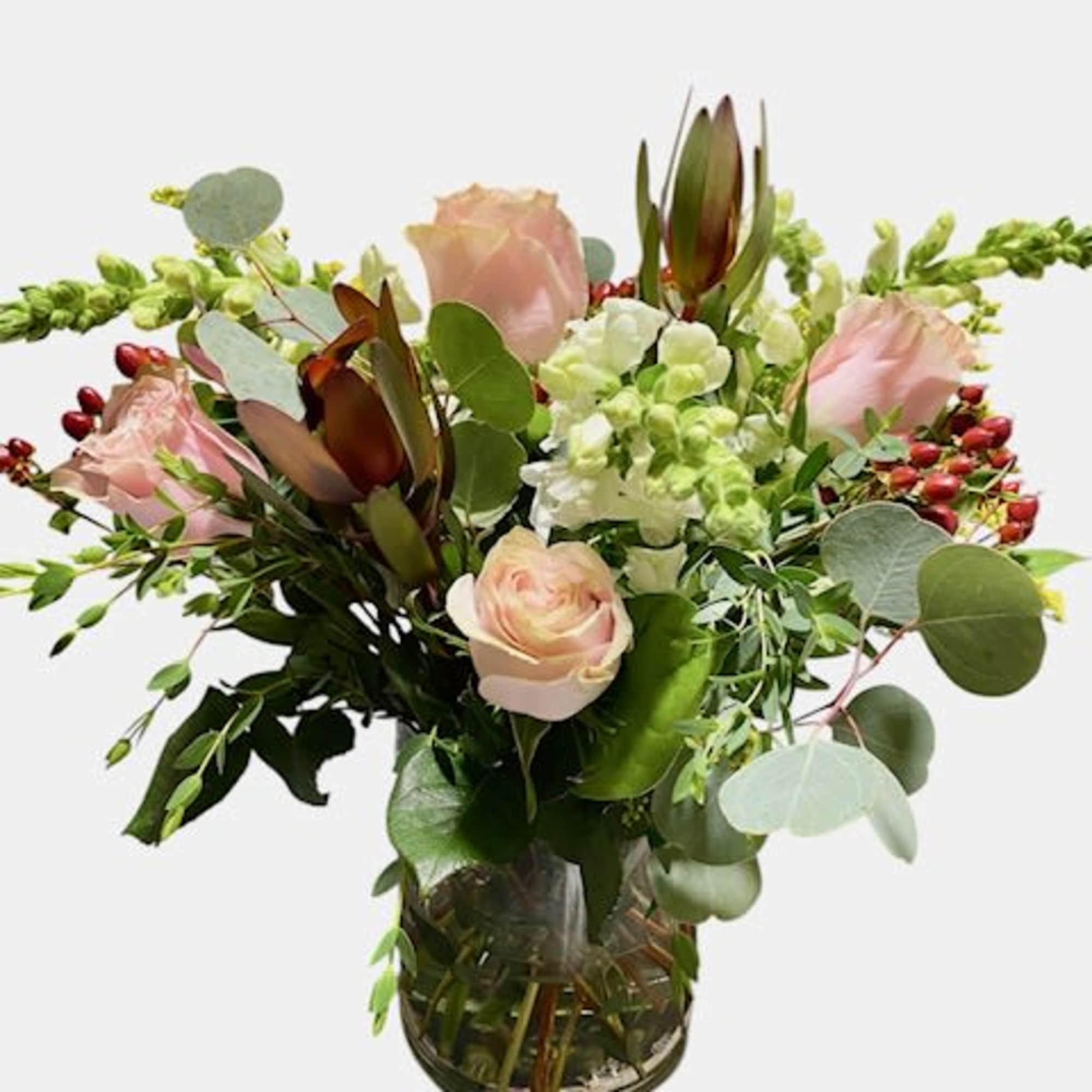 An artistic and Fall arrangement, this crowd pleaser is as interesting as