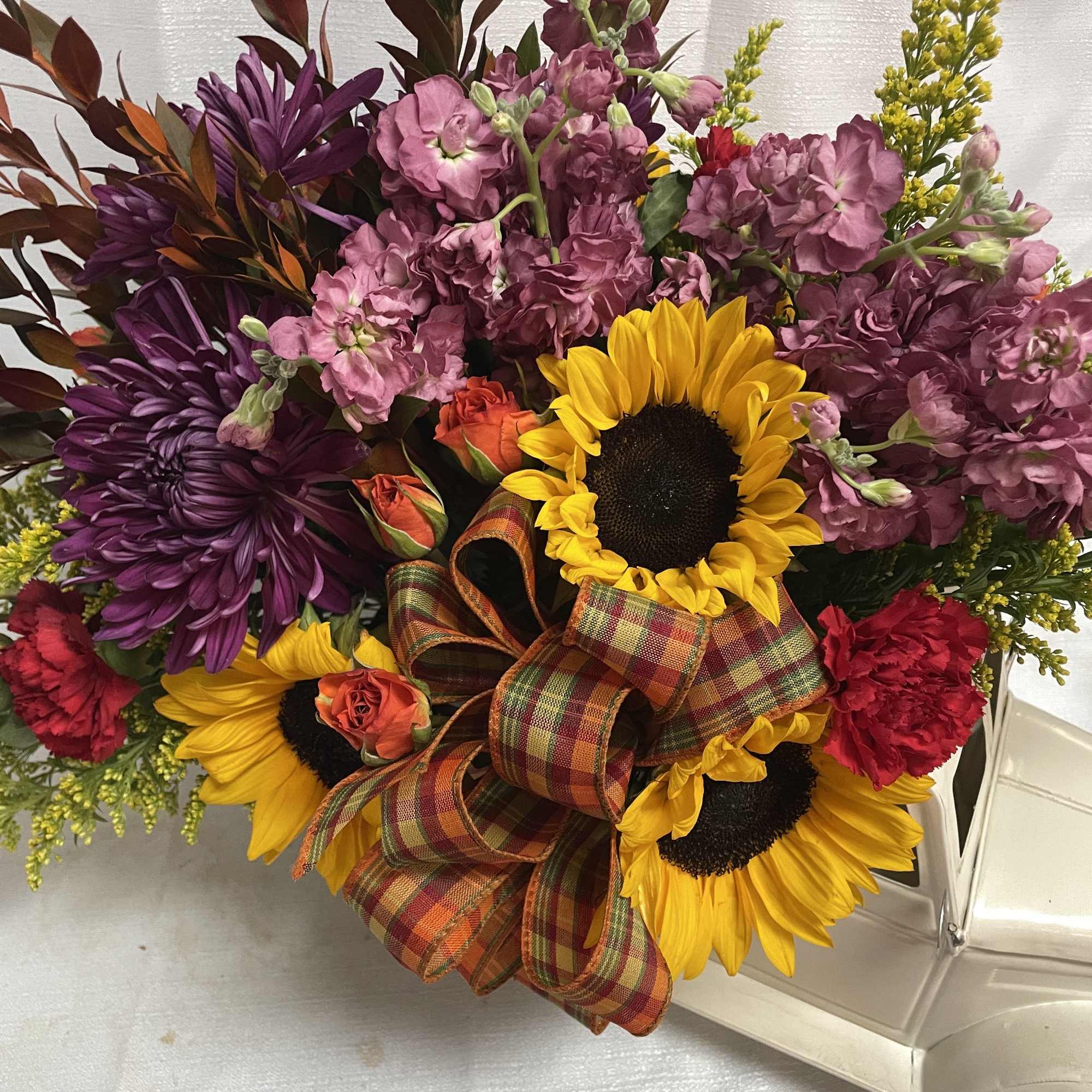 Inspired by a classic trip to the pumpkin patch, this arrangement features