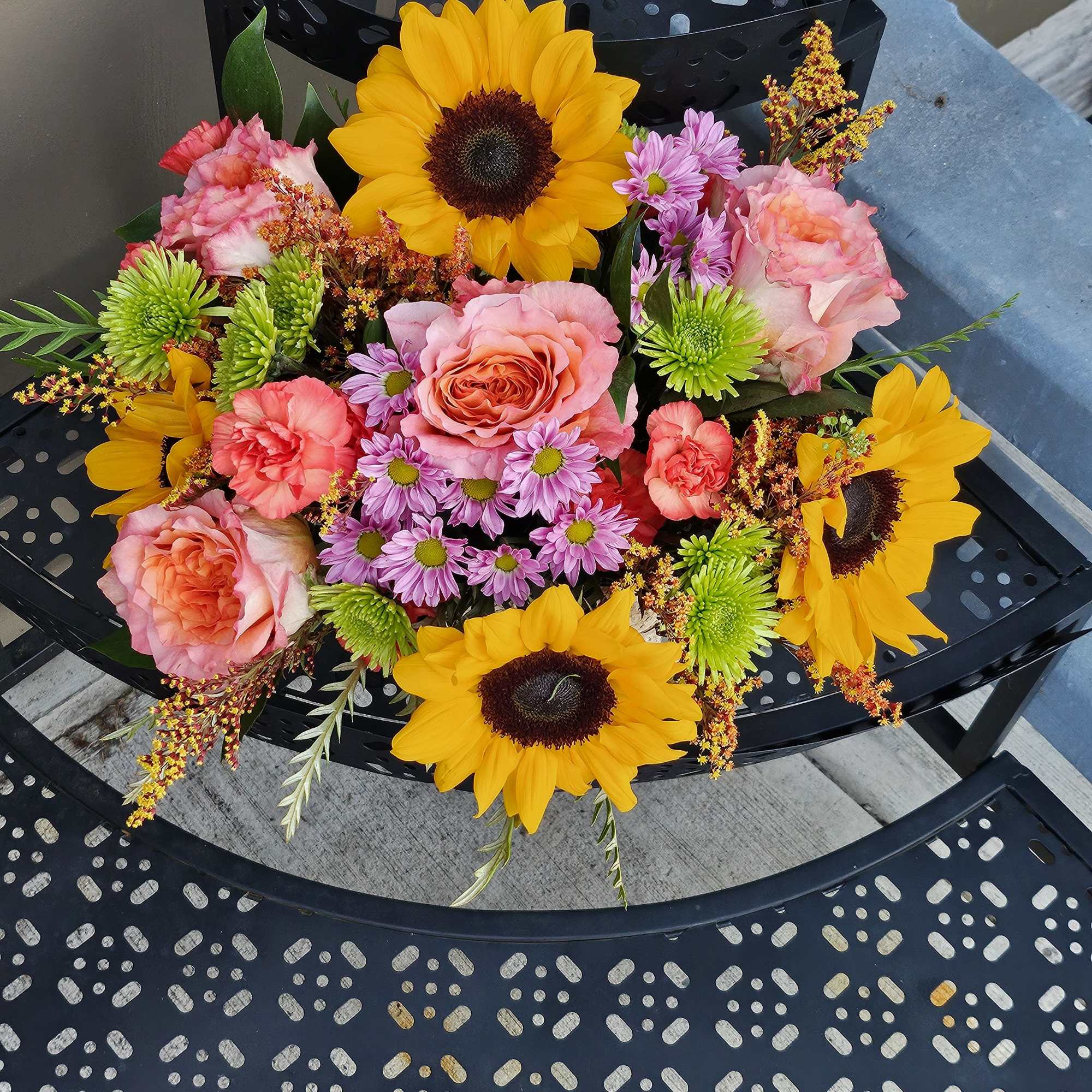 Autumn blooms in a wooden vase. 