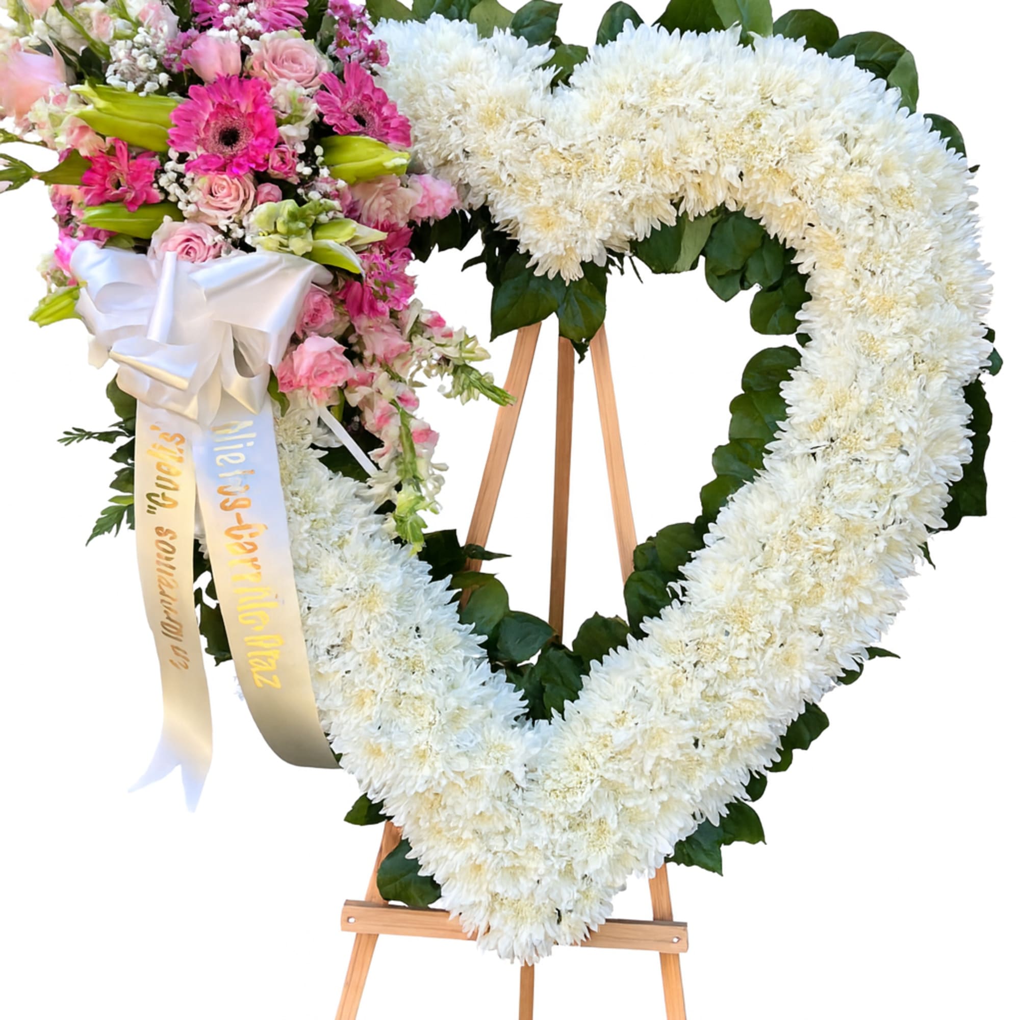 A tender expression if love and remembrance, this heart shaped floral arrangement