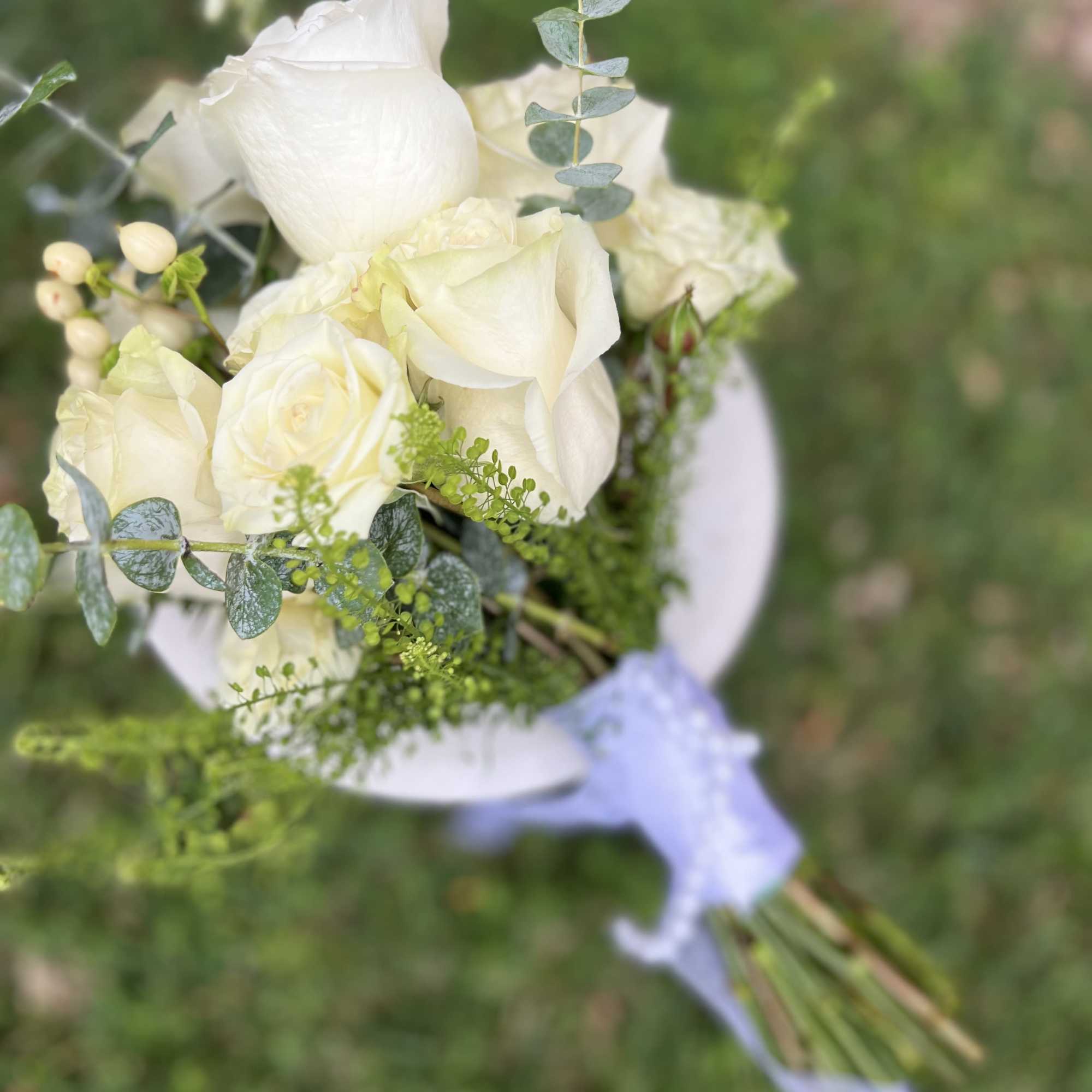 Product Information 
mix of all white florals such as roses, spray 