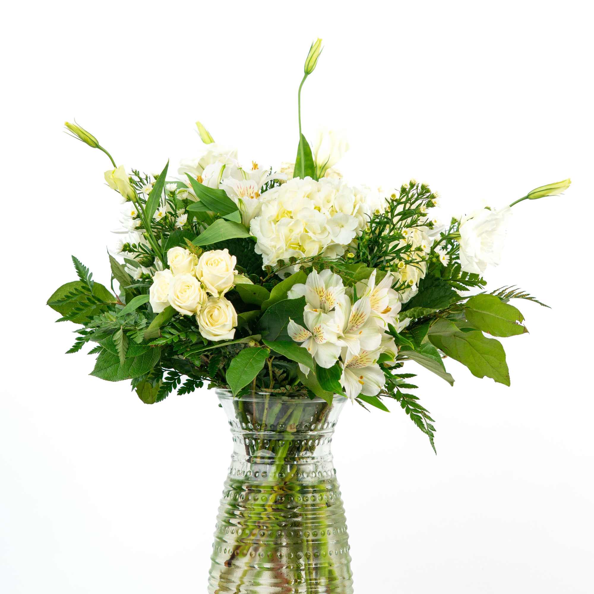 A soft, soothing floral arrangement in muted or white tones, paired with