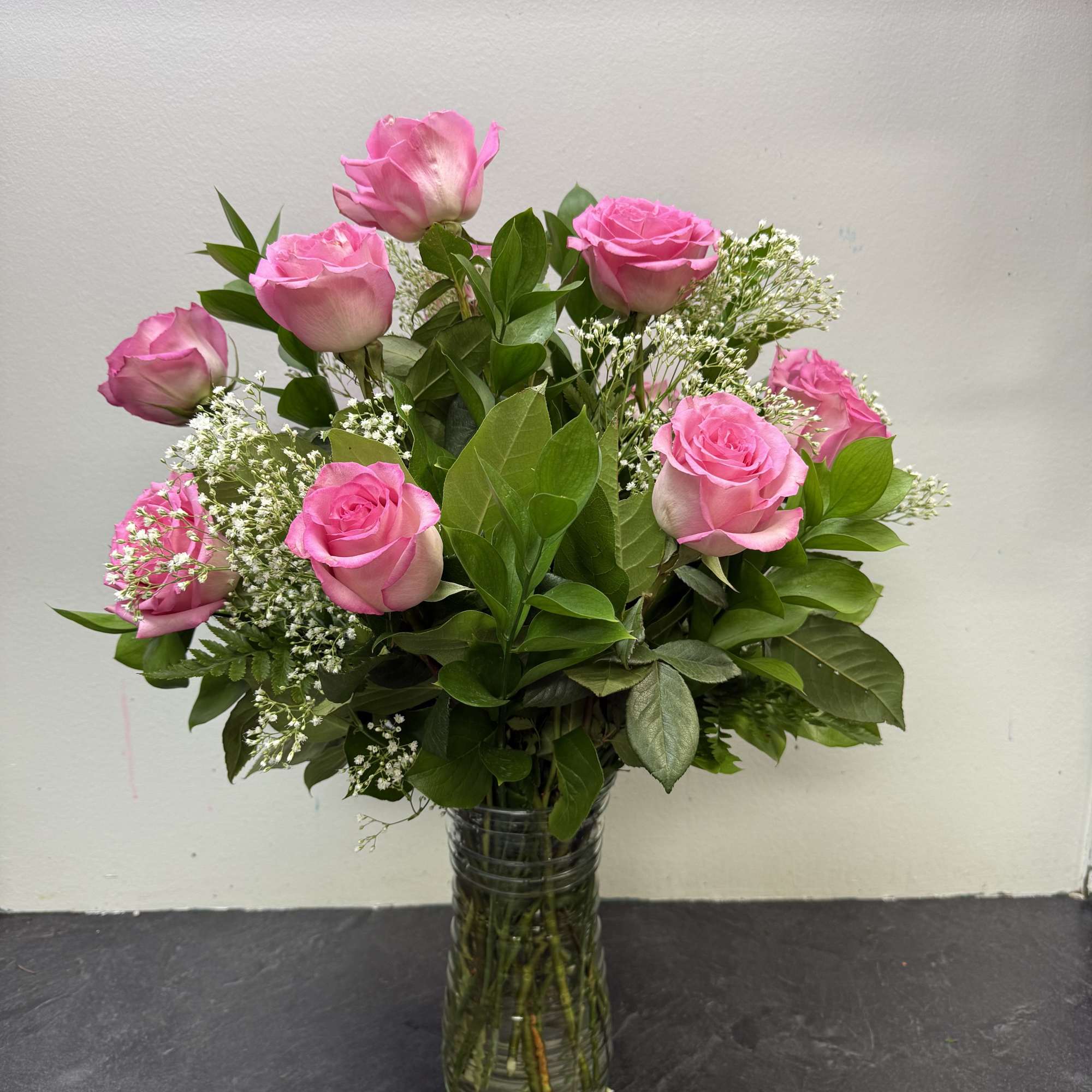 Soft, graceful, and full of charm, this beautiful arrangement showcases a dozen