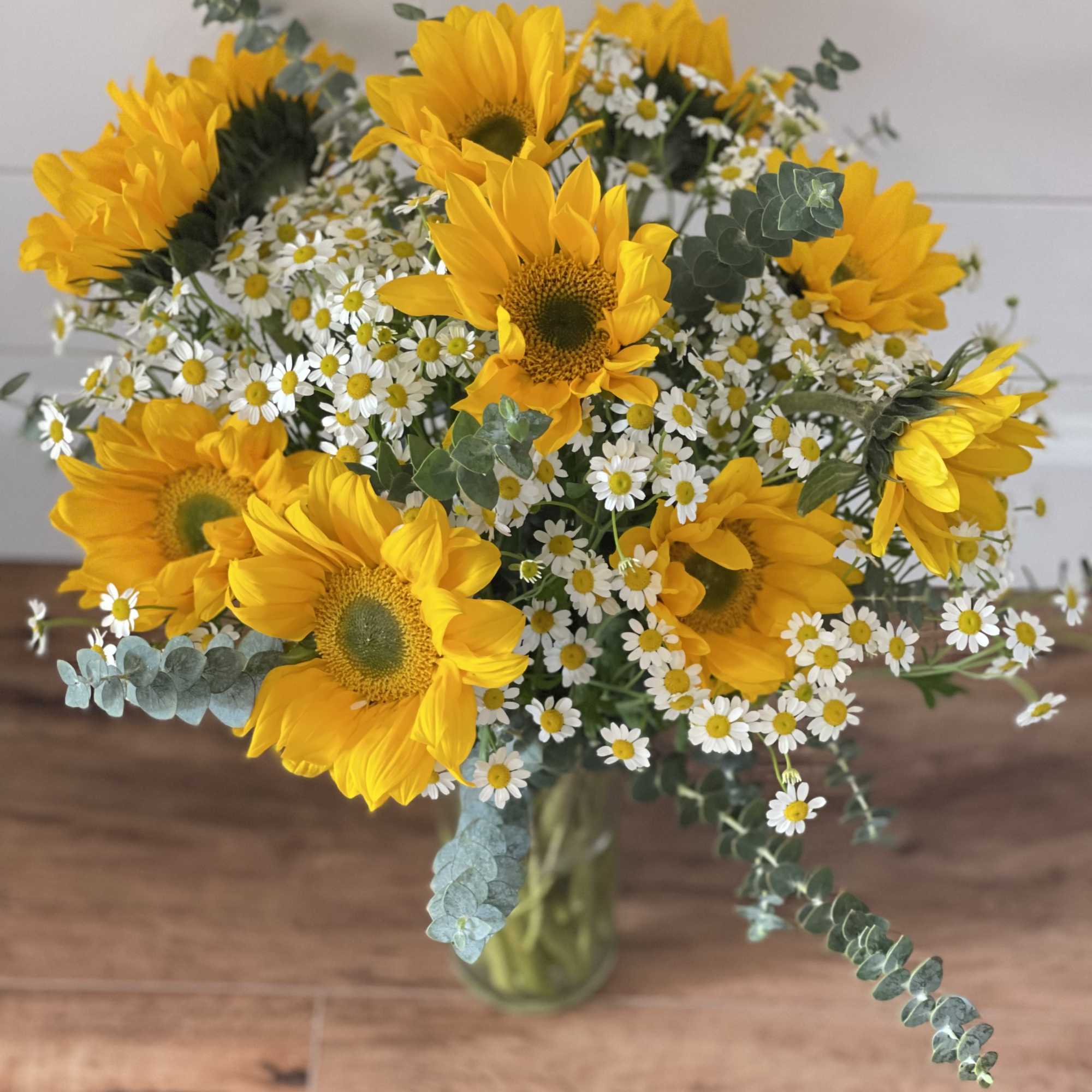 Sunflowers, eucalyptus and other bright and happy flowers to brighten anyone&rsquo;s day.