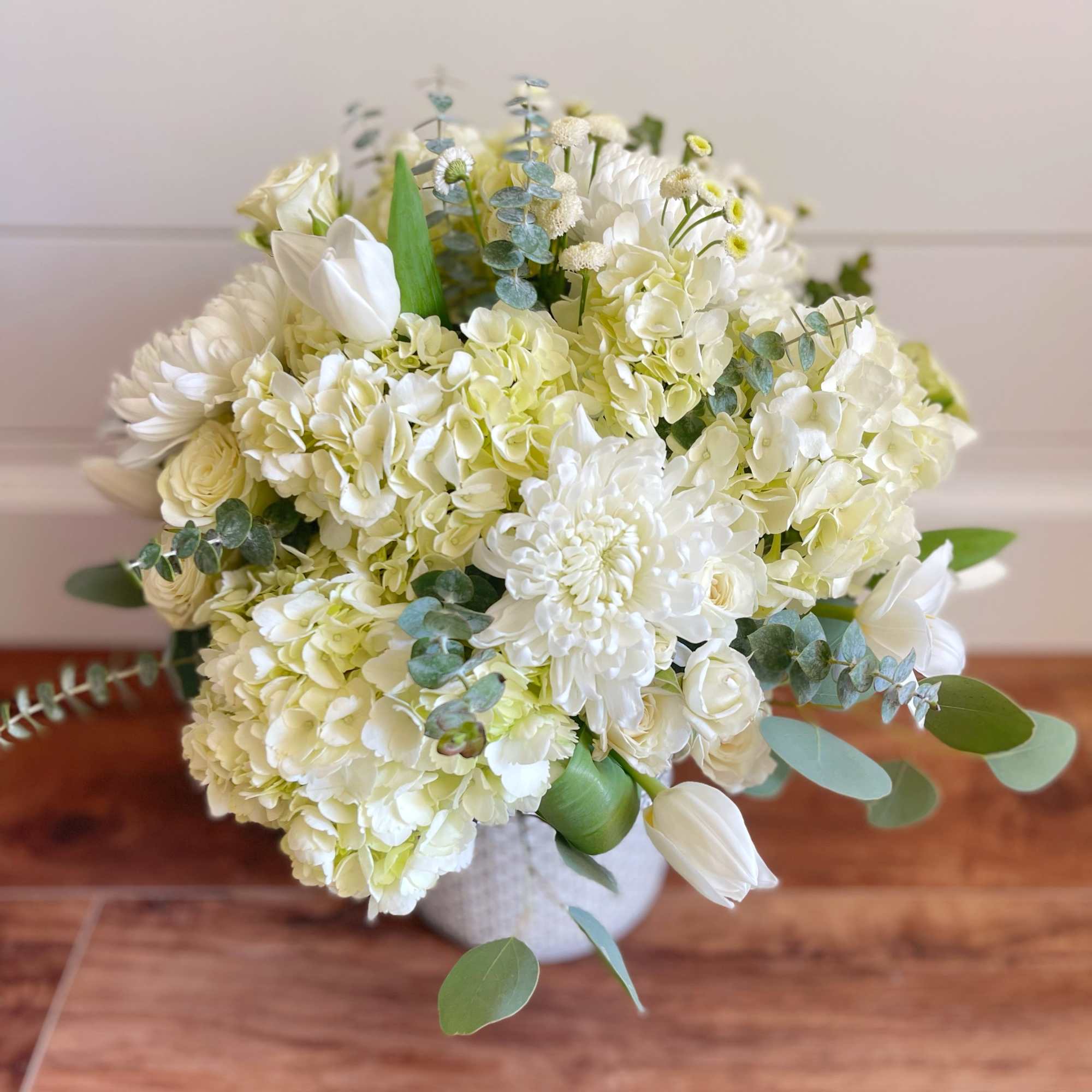 An arrangement that&rsquo;s beautiful and peaceful with  white roses, chrysanthemums, calla