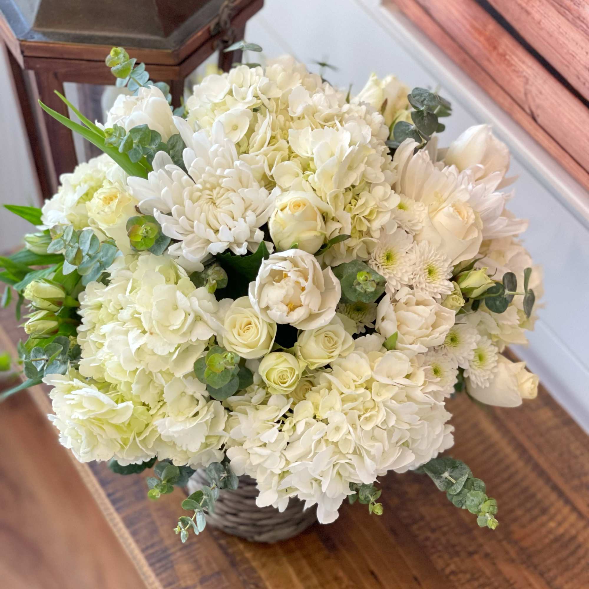 An arrangement that&rsquo;s beautiful and peaceful with  white roses, chrysanthemums, calla