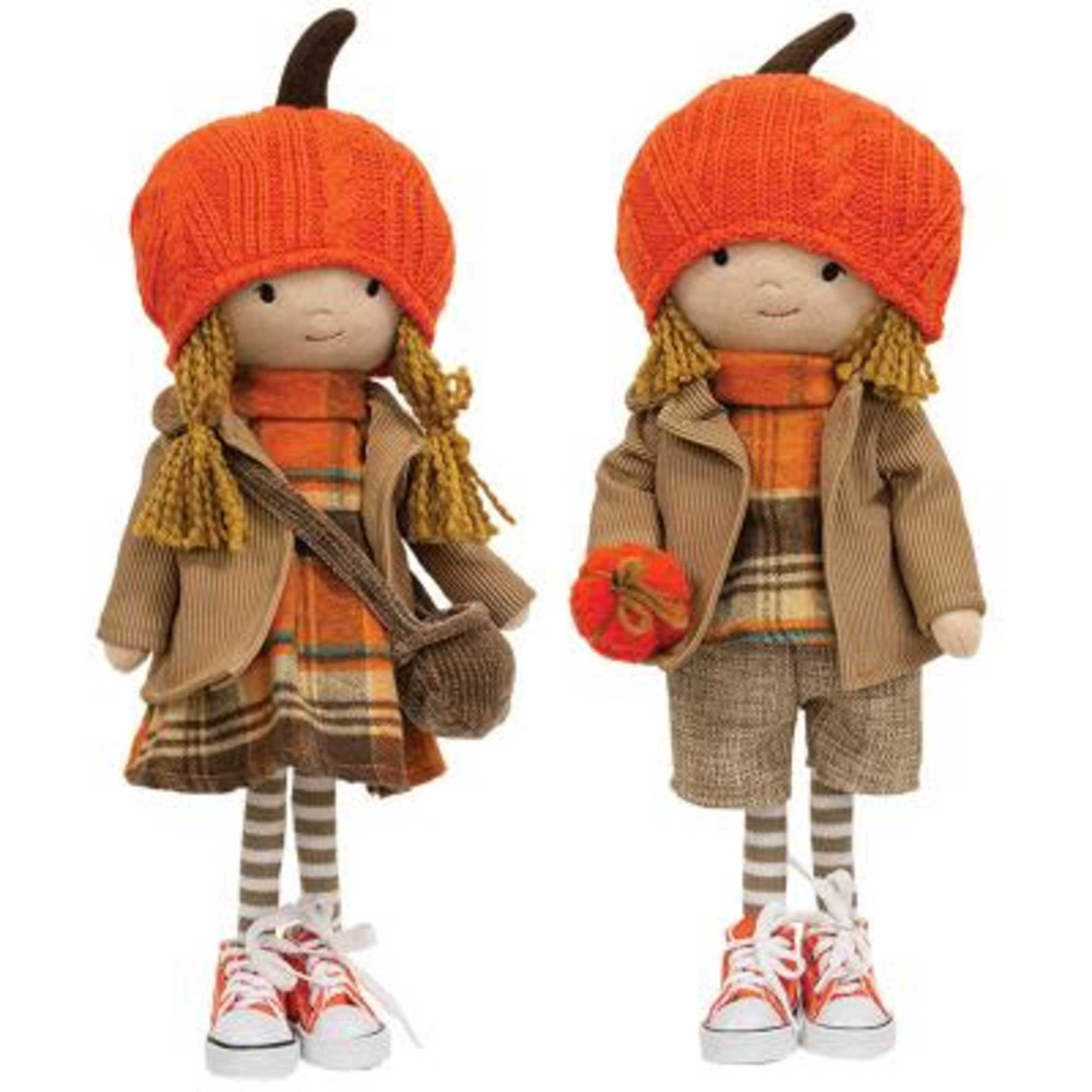 an autumn arrangement with pretty patty sitting amongst the flowers  
Standing