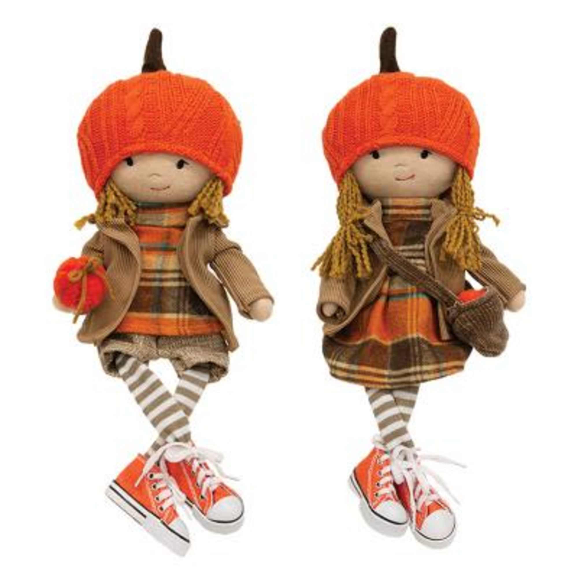 an autumn arrangement with pretty patty sitting amongst the flowers  
Standing