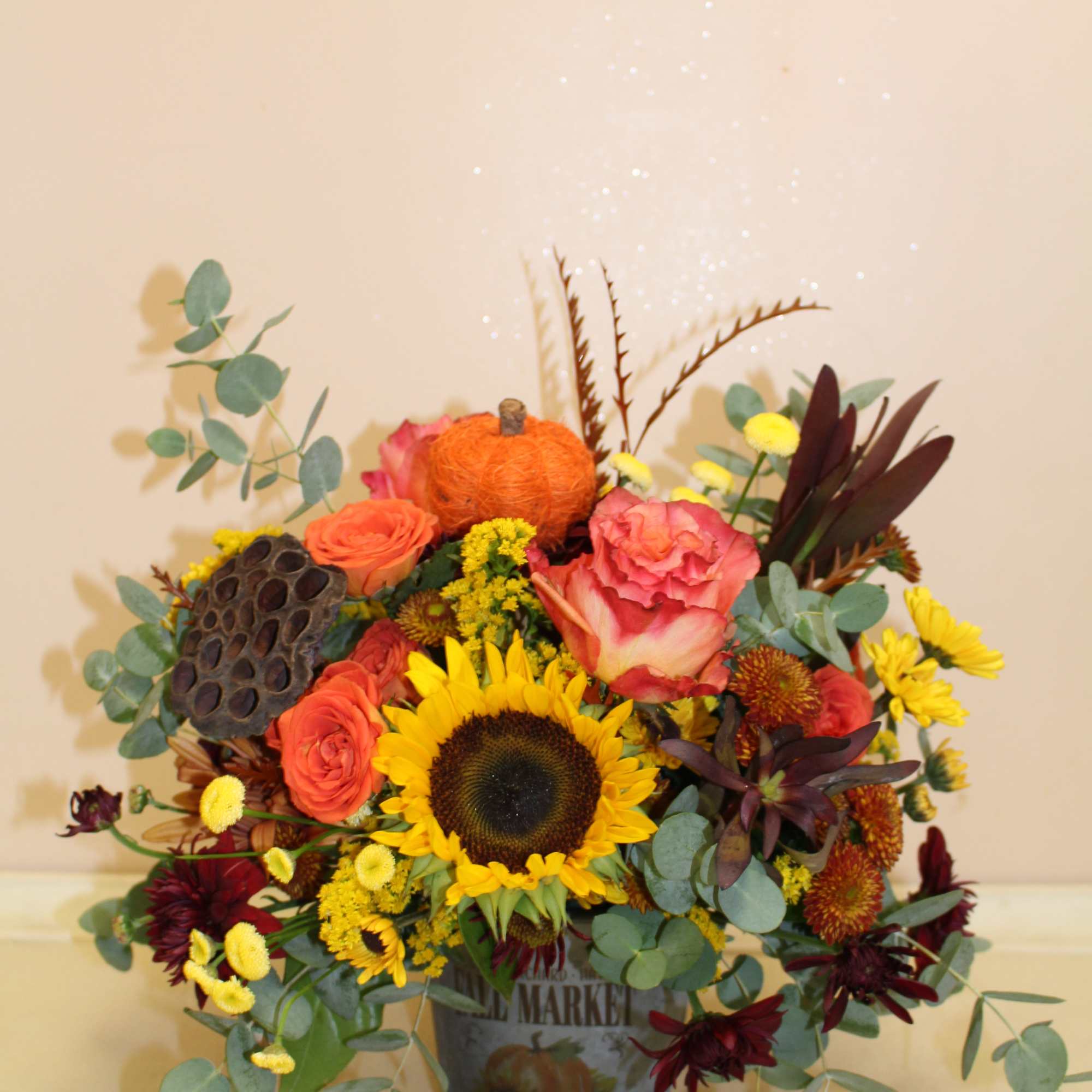 a sweet arrangement filled with fall flowers 