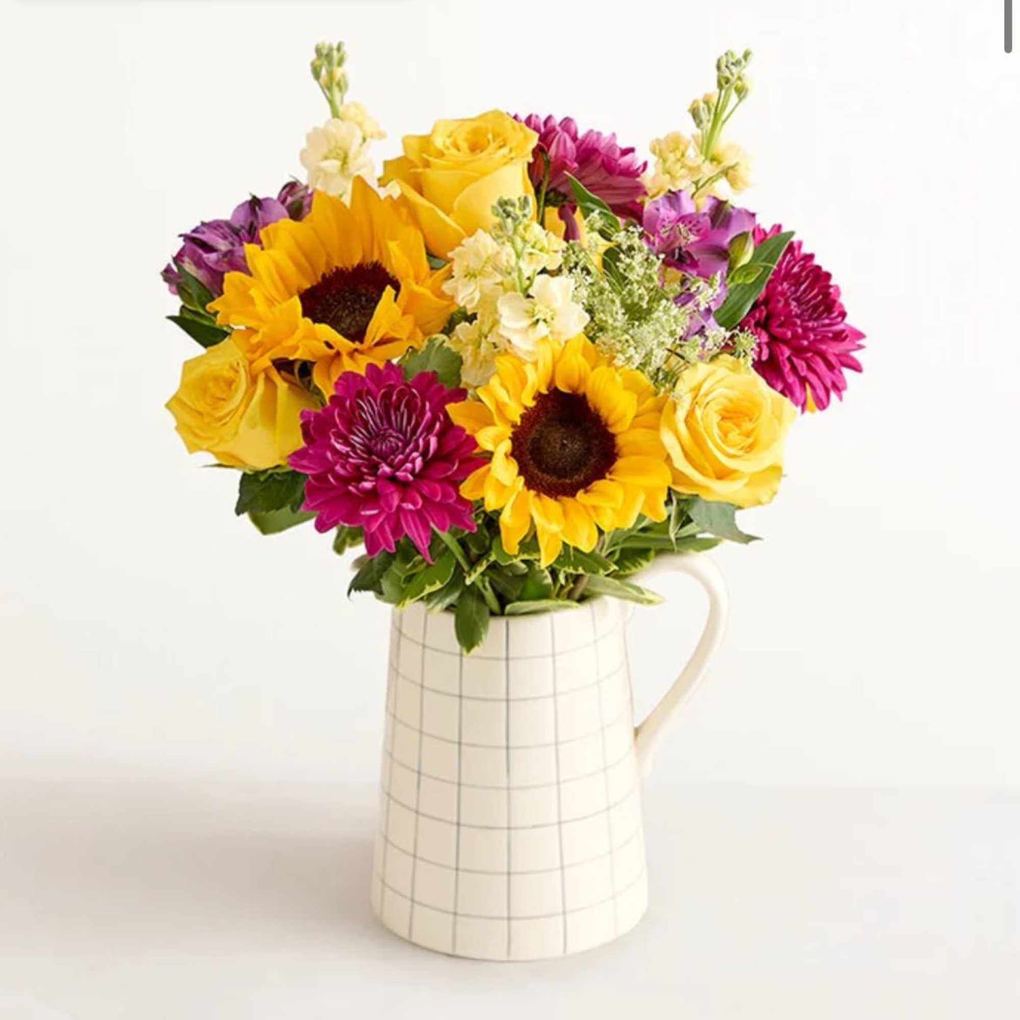Make someone&rsquo;s day a lot brighter with this mixed arrangement in a
