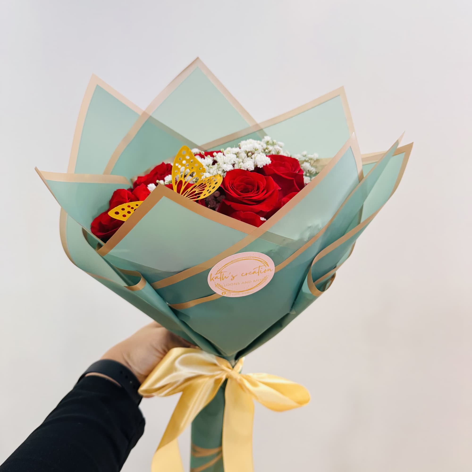 Its combination of classic romance (roses), softness (baby&#039;s breath), and creativity (butterfly)