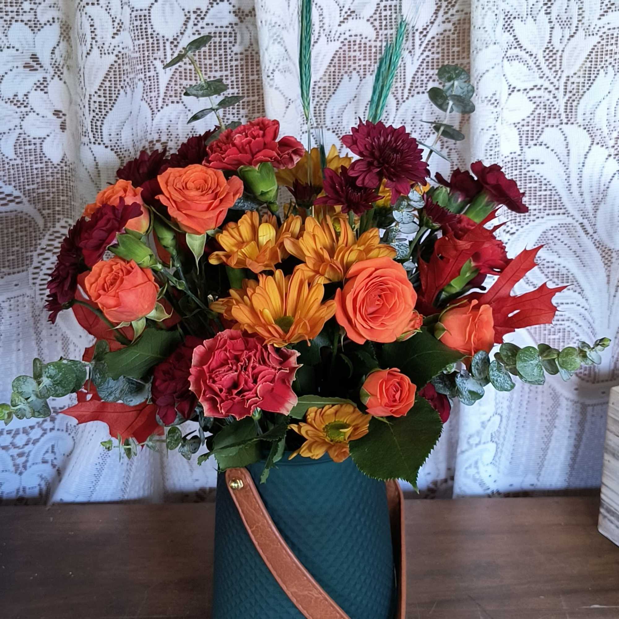 Beautiful and Bold the rich colors of this fall bouquet. Artfully arranged Beautiful and Bold the rich colors of this fall bouquet. Artfully arranged