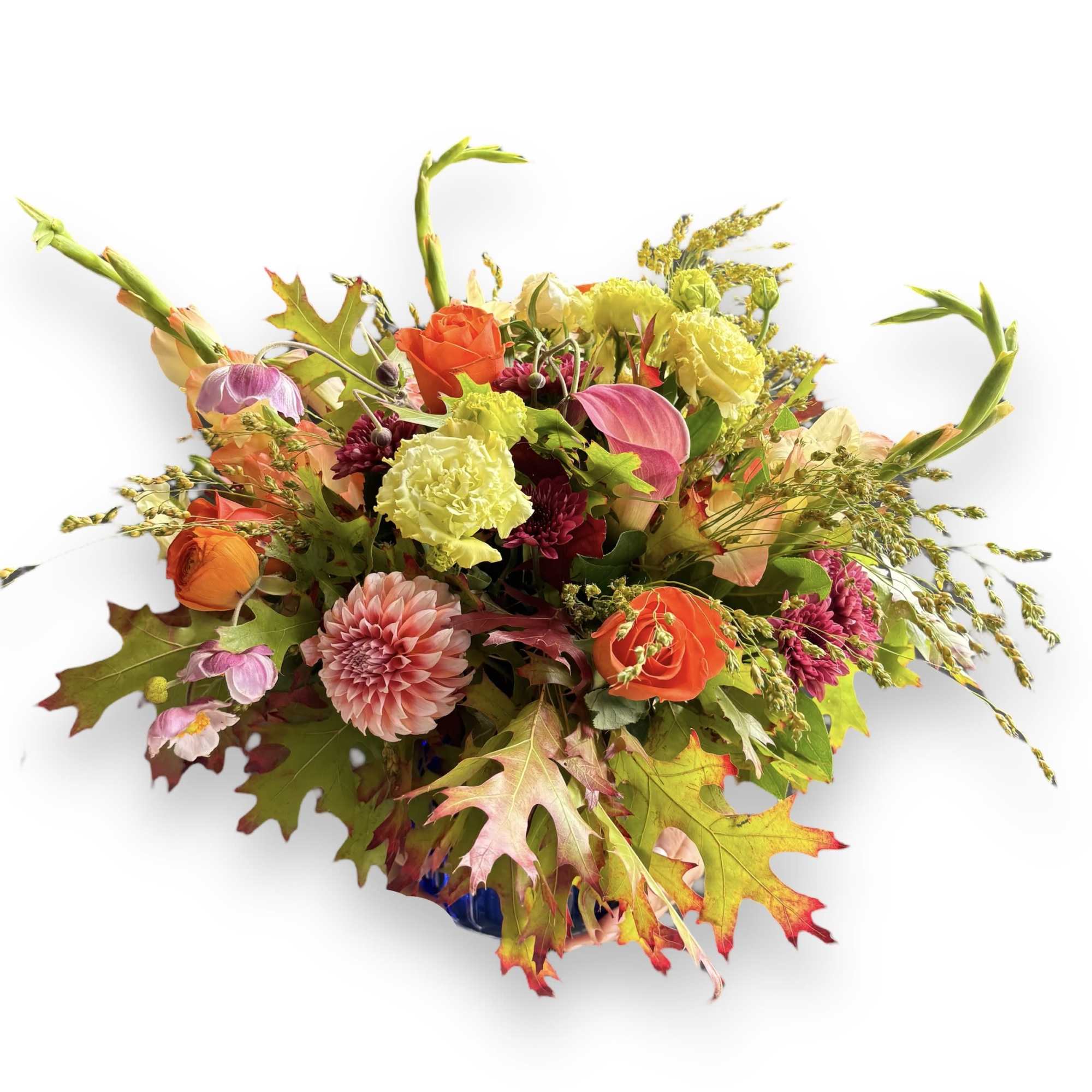 Utilizing the perfect fall hues, this low and round arrangement brings a