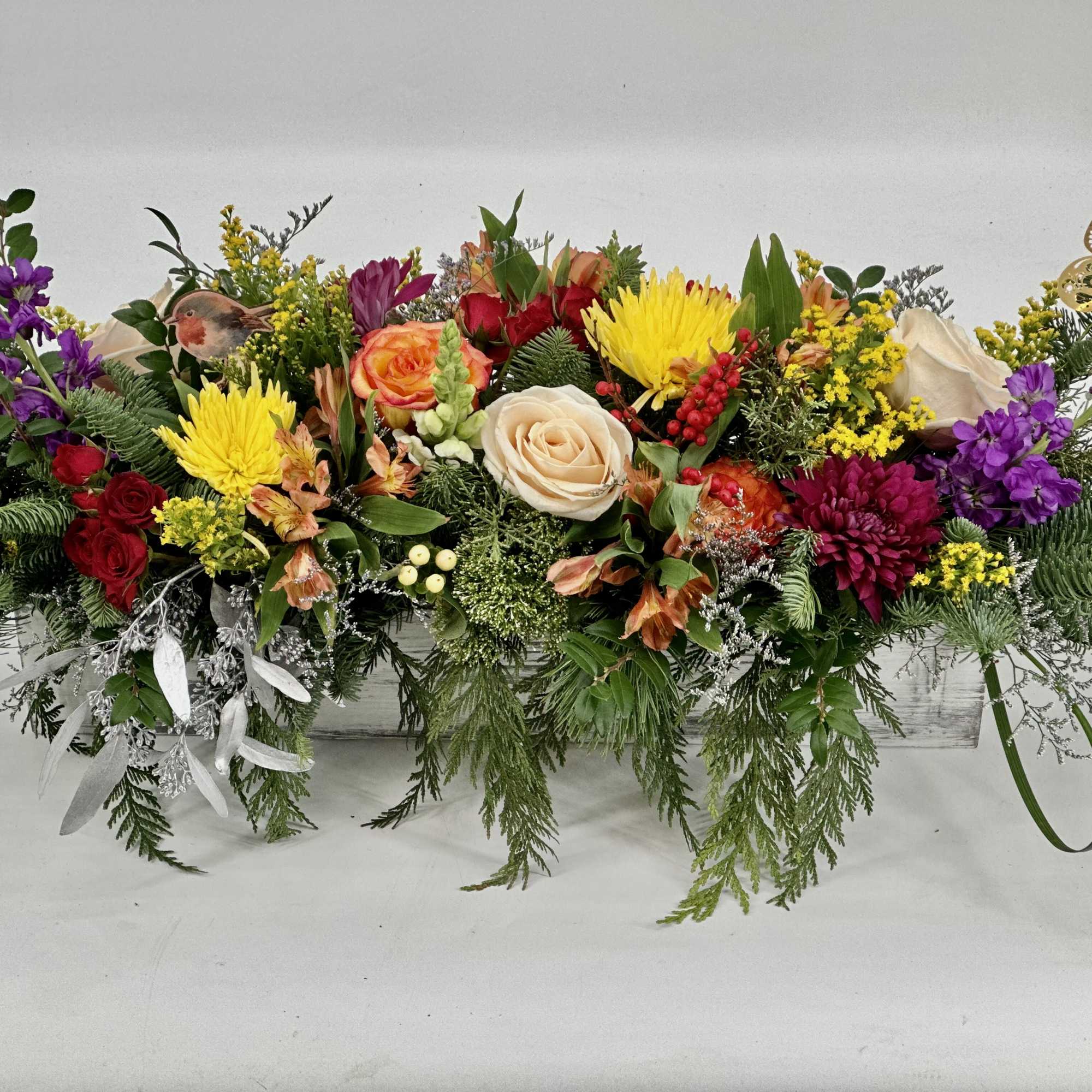 Make any table beautiful with Springtime Featuring a variety of roses and