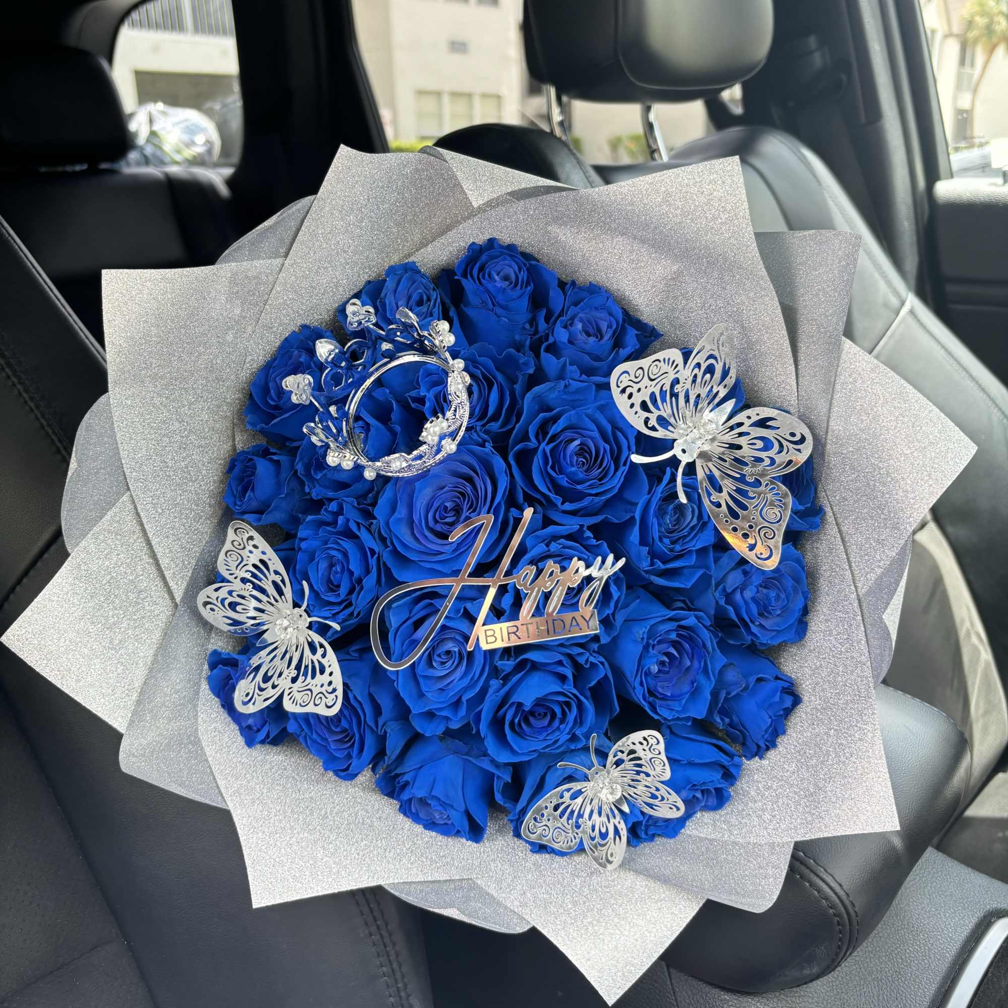 Celebrate in style with this striking arrangement of vibrant royal blue roses