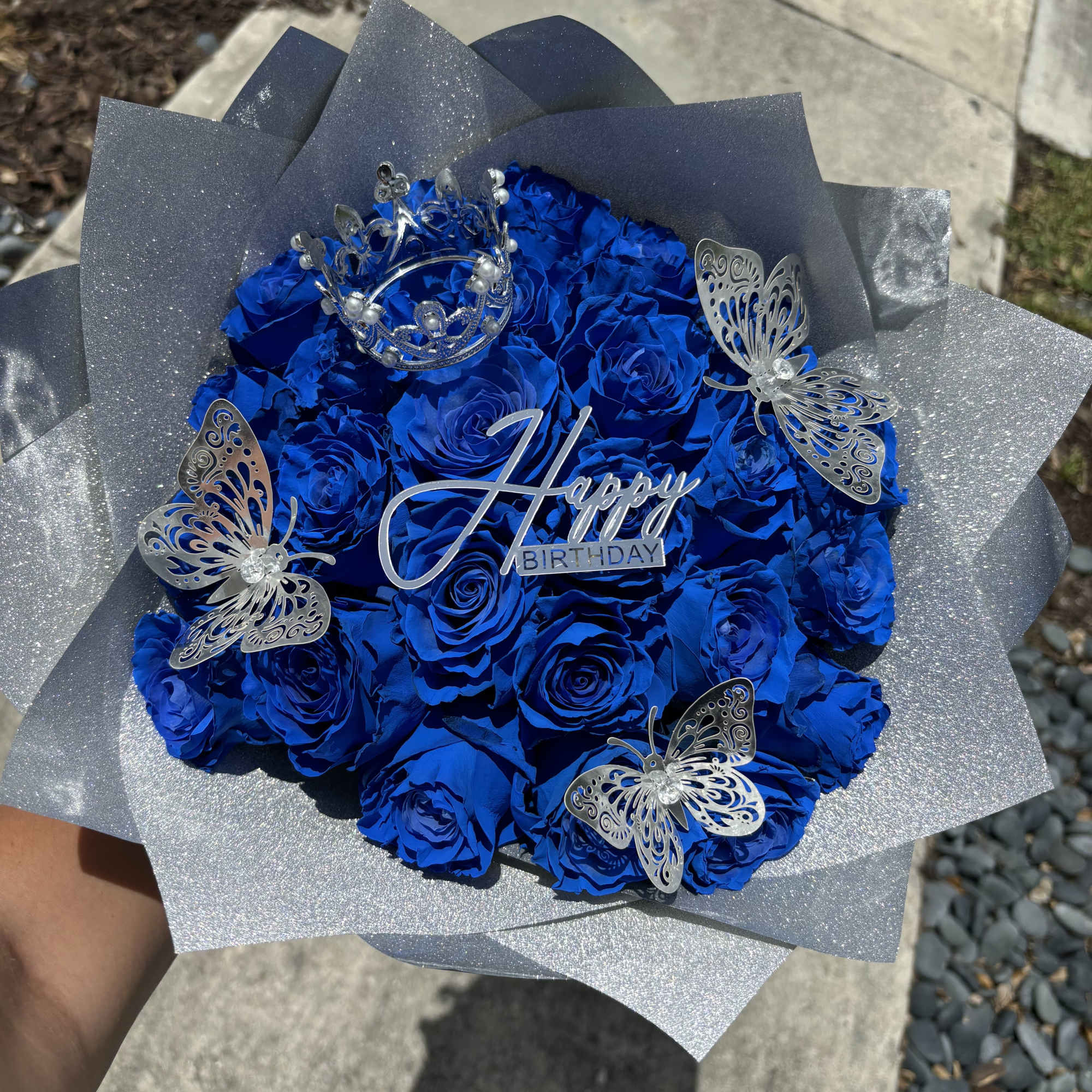 Celebrate in style with this striking arrangement of vibrant royal blue roses