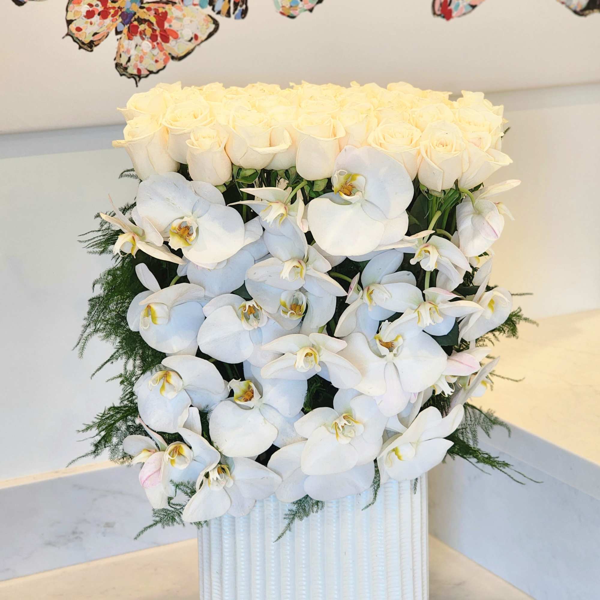 This luxurious arrangement combines the soft beauty of blush pink roses with