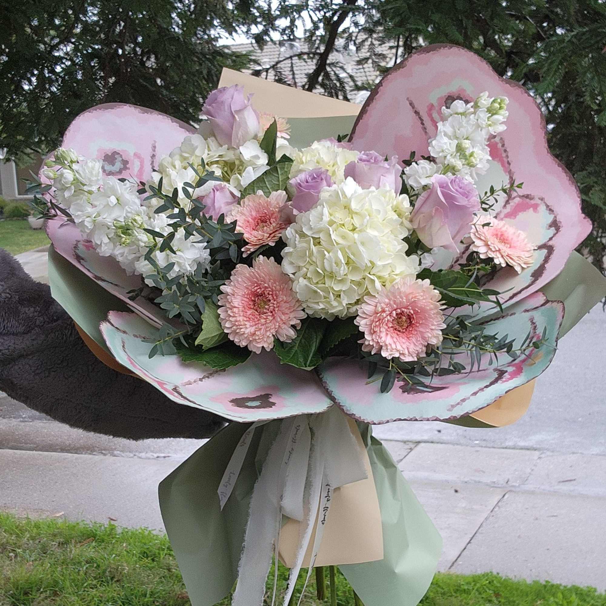 This is very unique arrangement with a beautiful butterfly wings. The flowers