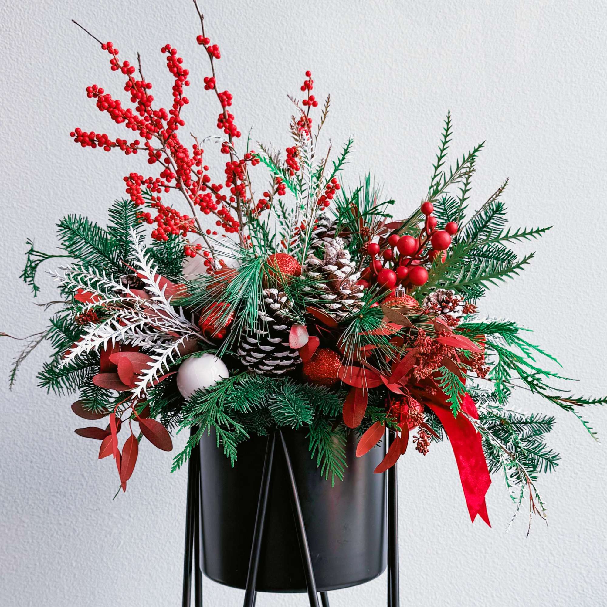 This breathtaking Christmas bouquet captures the essence of winter festivities with its This breathtaking Christmas bouquet captures the essence of winter festivities with its