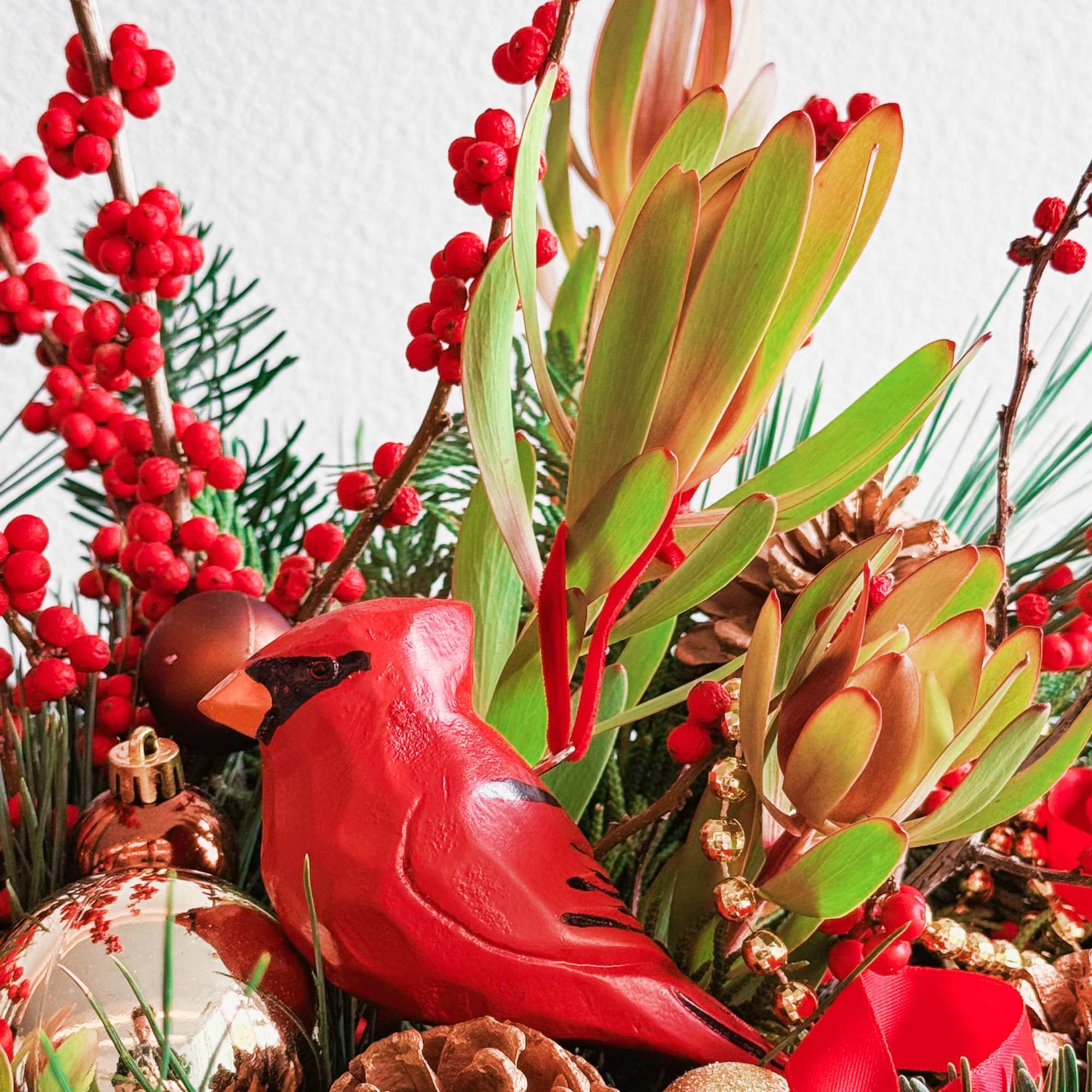 This Christmas bouquet radiates festive warmth and charm, combining vibrant red and This Christmas bouquet radiates festive warmth and charm, combining vibrant red and