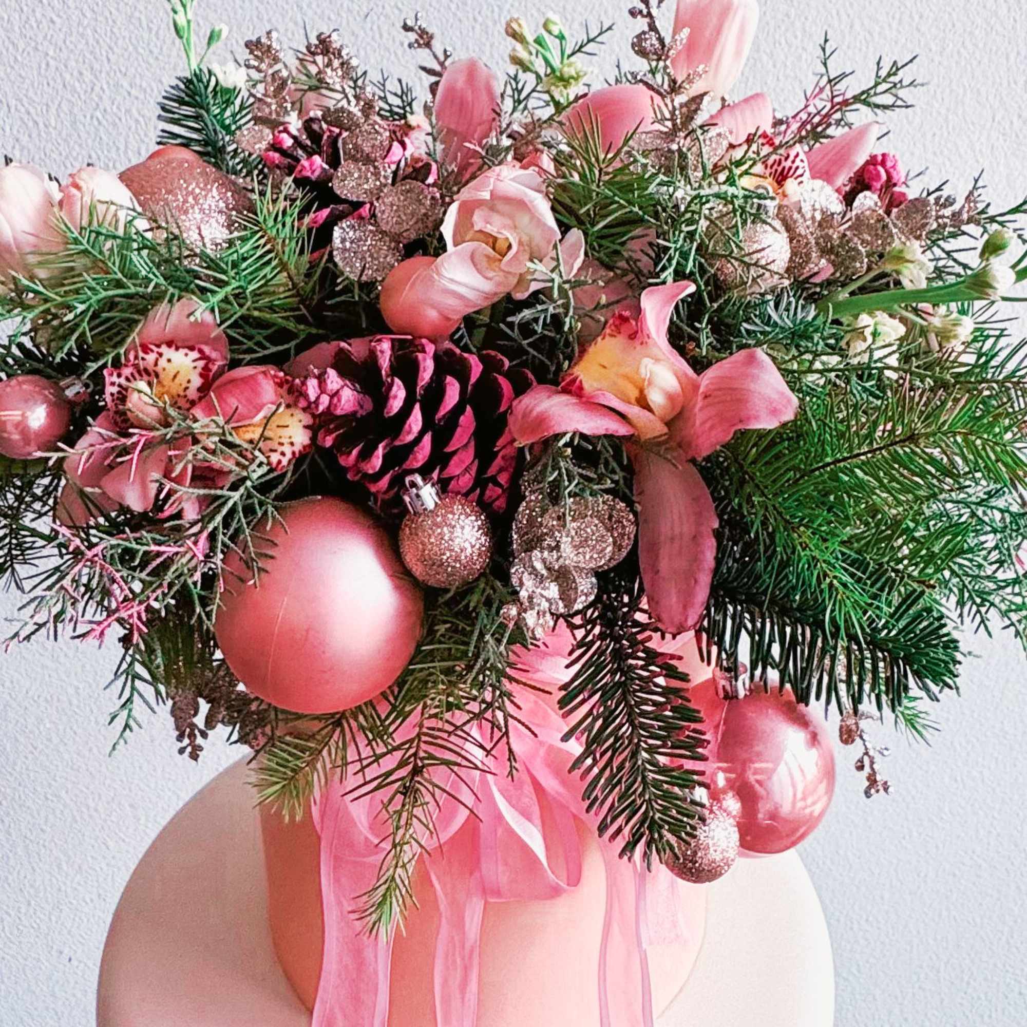This Christmas arrangement is a festive and elegant centerpiece designed to bring This Christmas arrangement is a festive and elegant centerpiece designed to bring