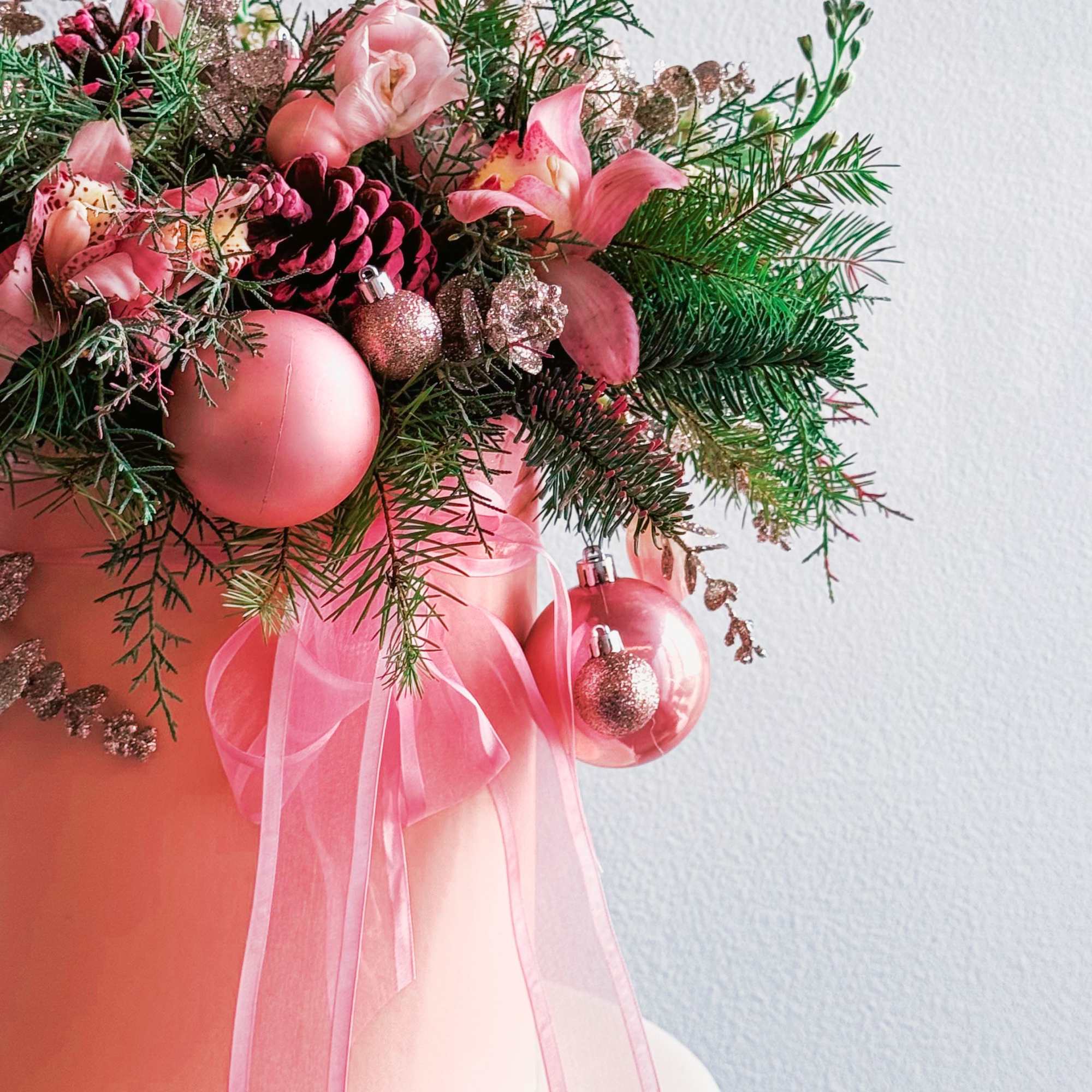 This Christmas arrangement is a festive and elegant centerpiece designed to bring This Christmas arrangement is a festive and elegant centerpiece designed to bring