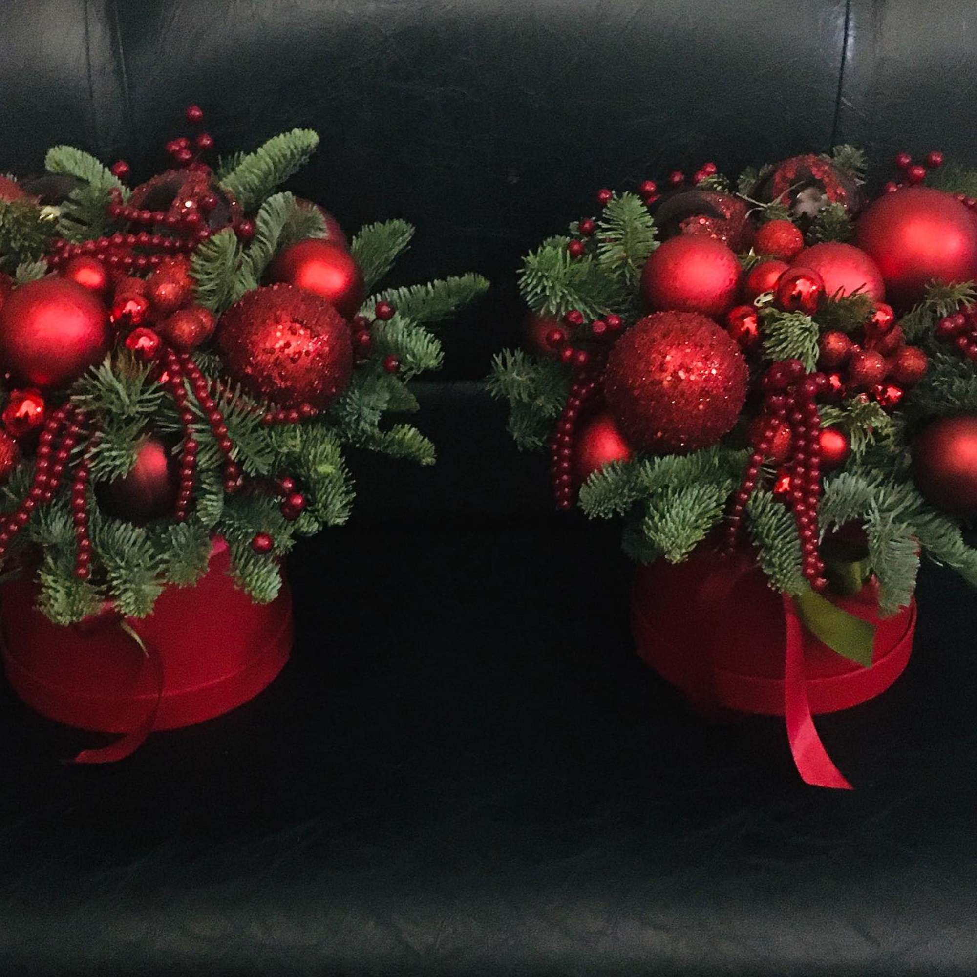 Red Christmas. Red berries, red balls and green spruce branches. They create Red Christmas. Red berries, red balls and green spruce branches. They create