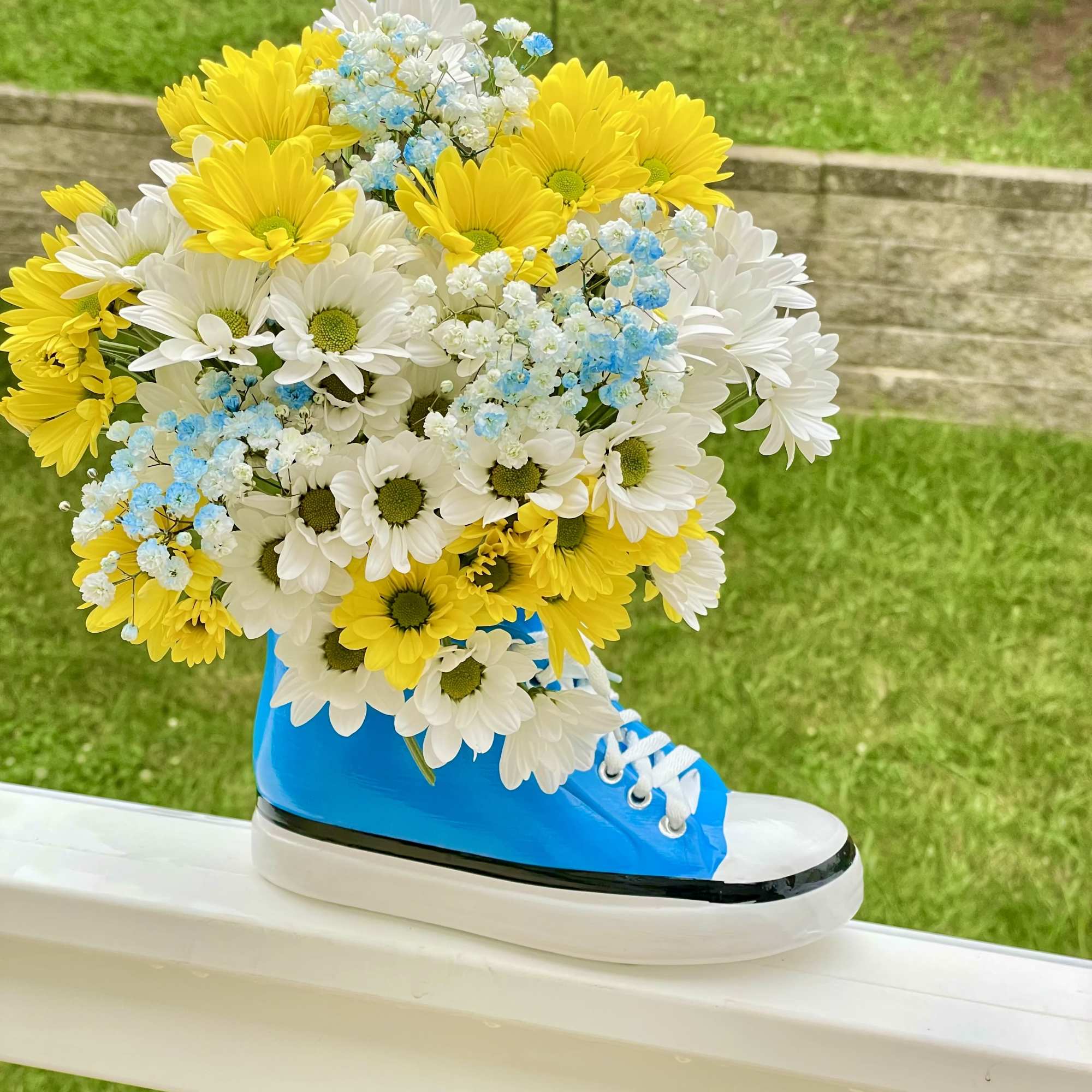 Step up your gift-giving game with our Kickin&#039; It With Daisies arrangement!