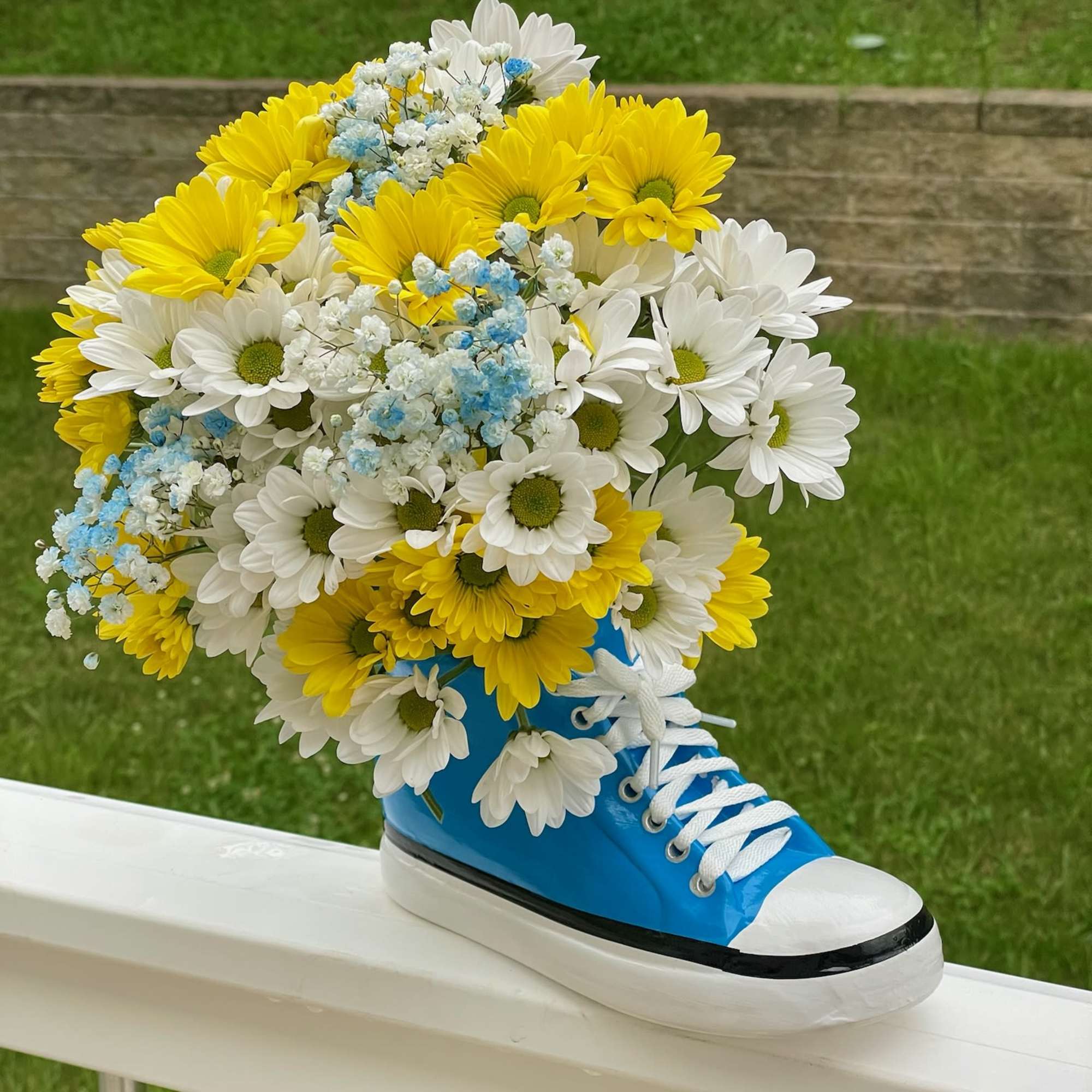 Step up your gift-giving game with our Kickin&#039; It With Daisies arrangement!