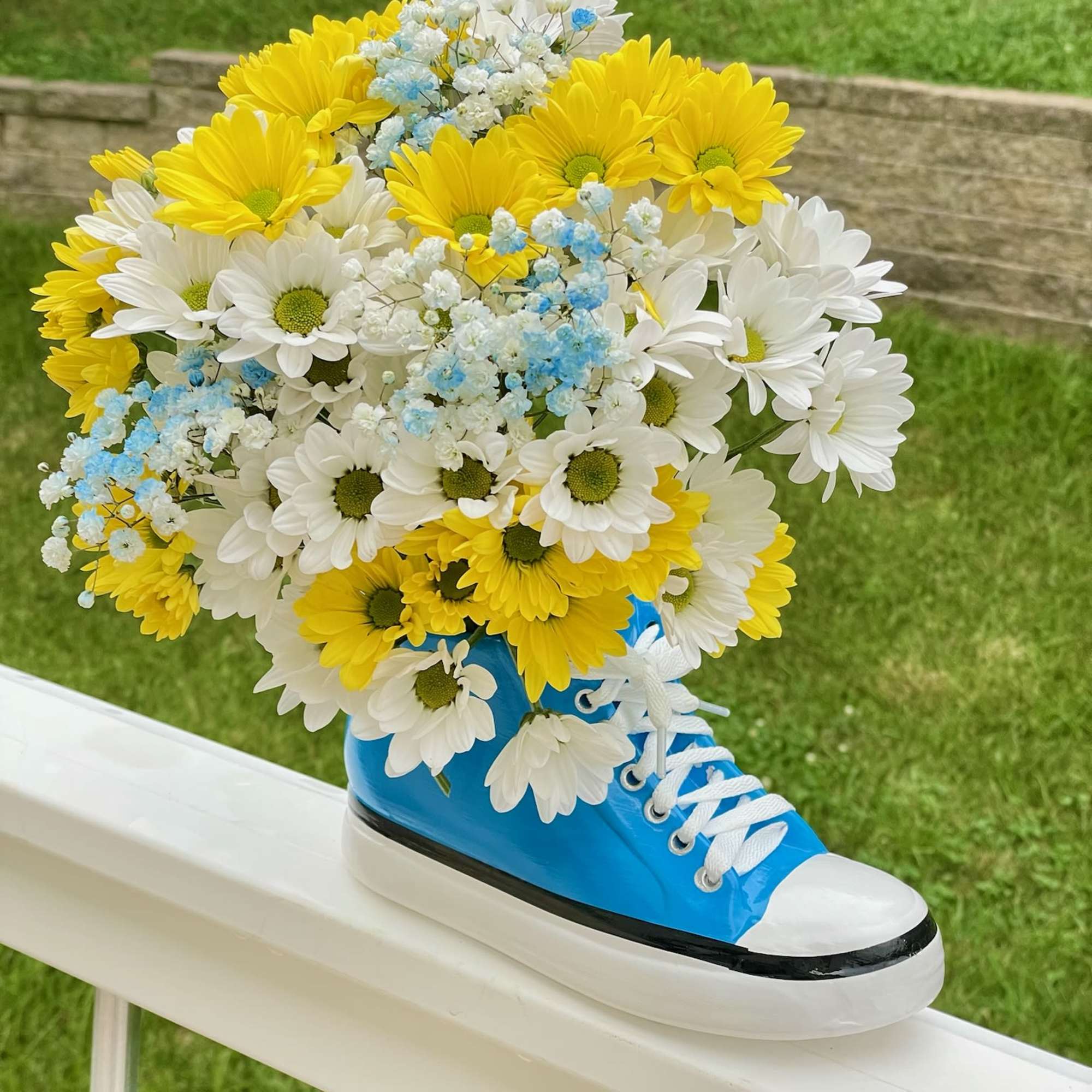 Step up your gift-giving game with our Kickin&#039; It With Daisies arrangement!