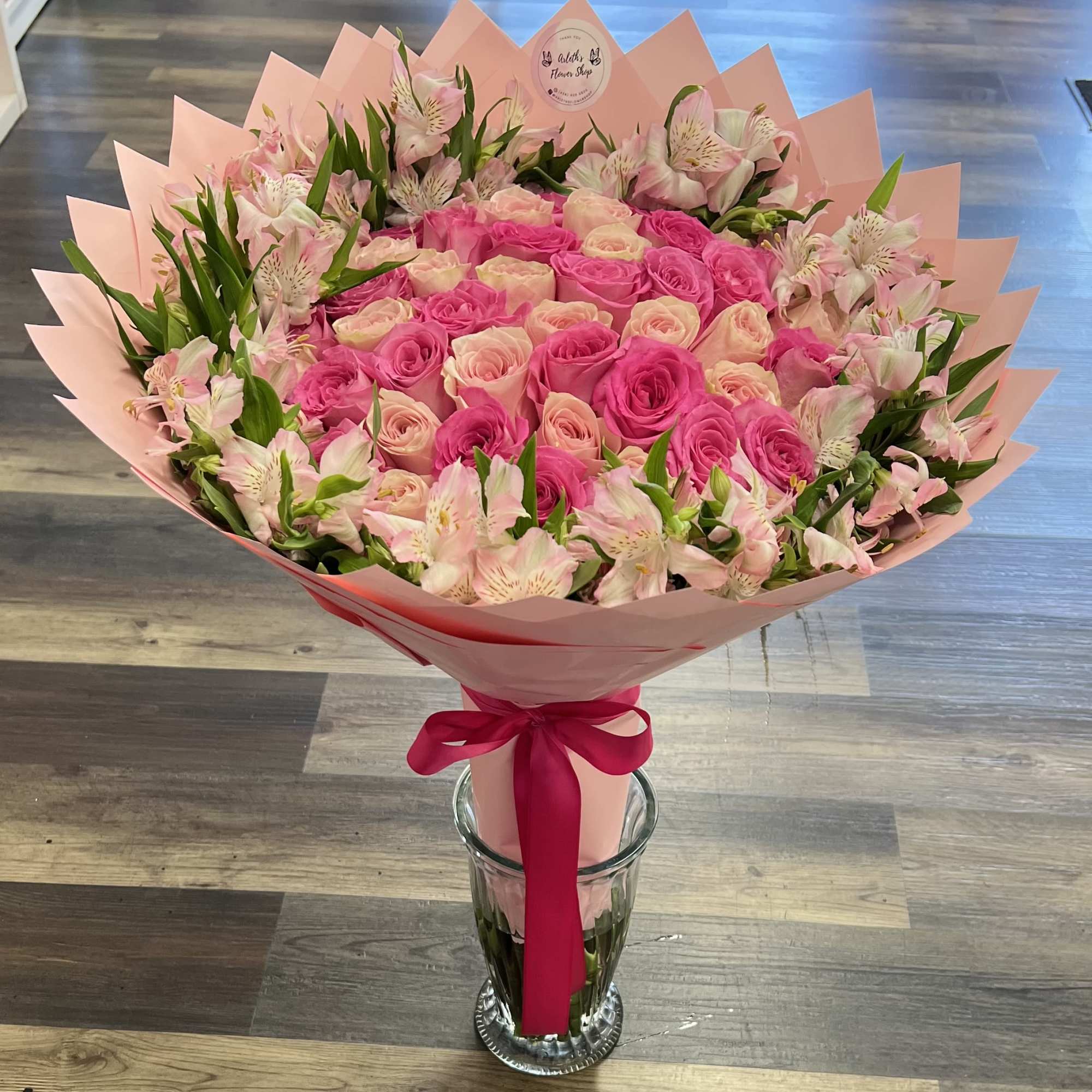 Buyer will receive 50 pink roses with alstroemeria around. 