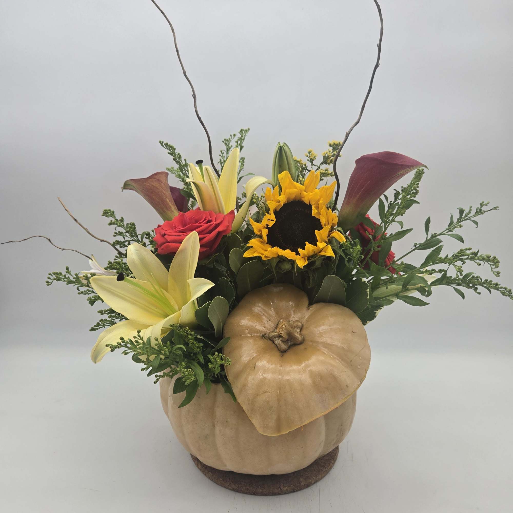 Enjoy a custom fresh fall arrangement in a fresh &quot;real&quot; pumpkin. 
