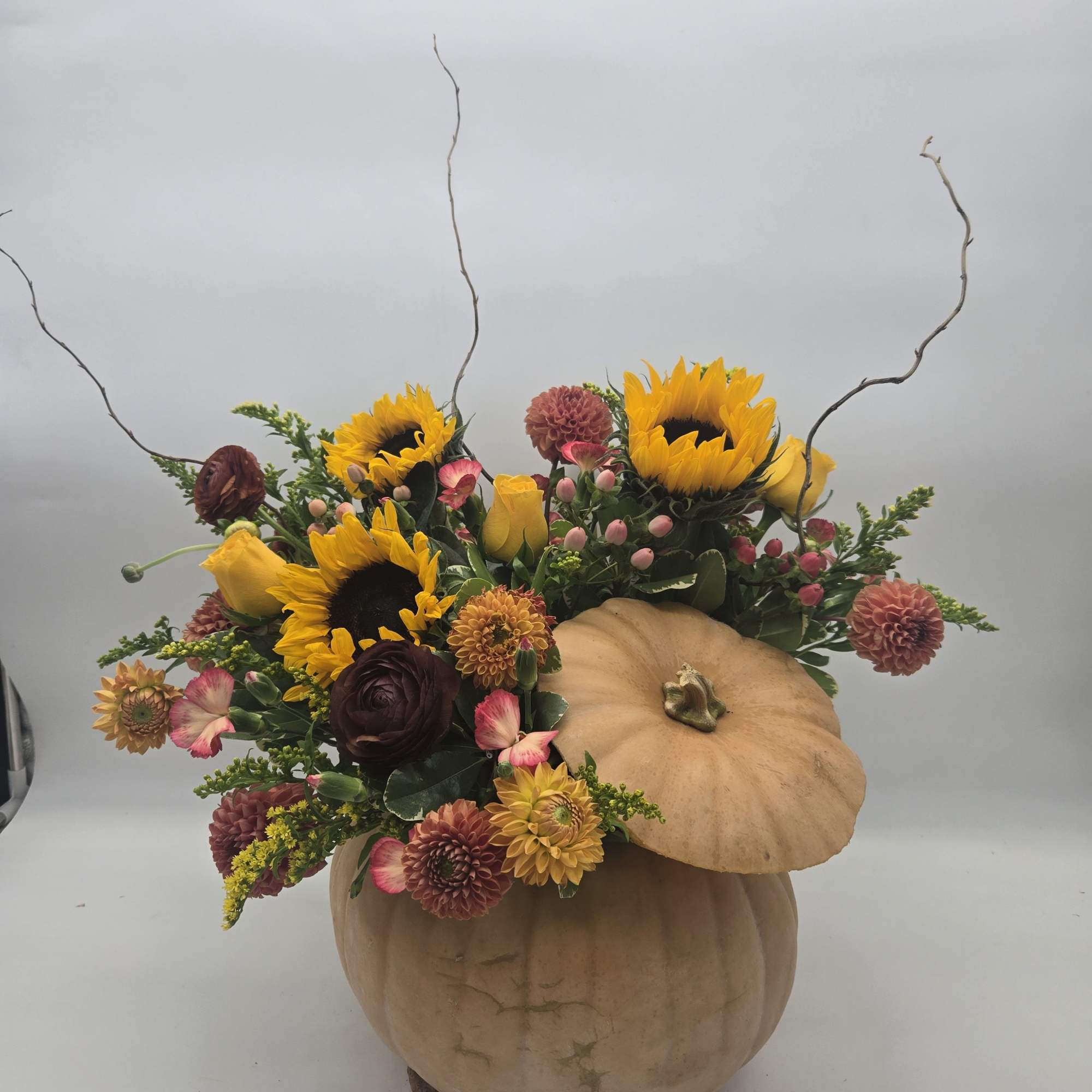 Enjoy a custom fresh fall arrangement in a fresh &quot;real&quot; pumpkin. 