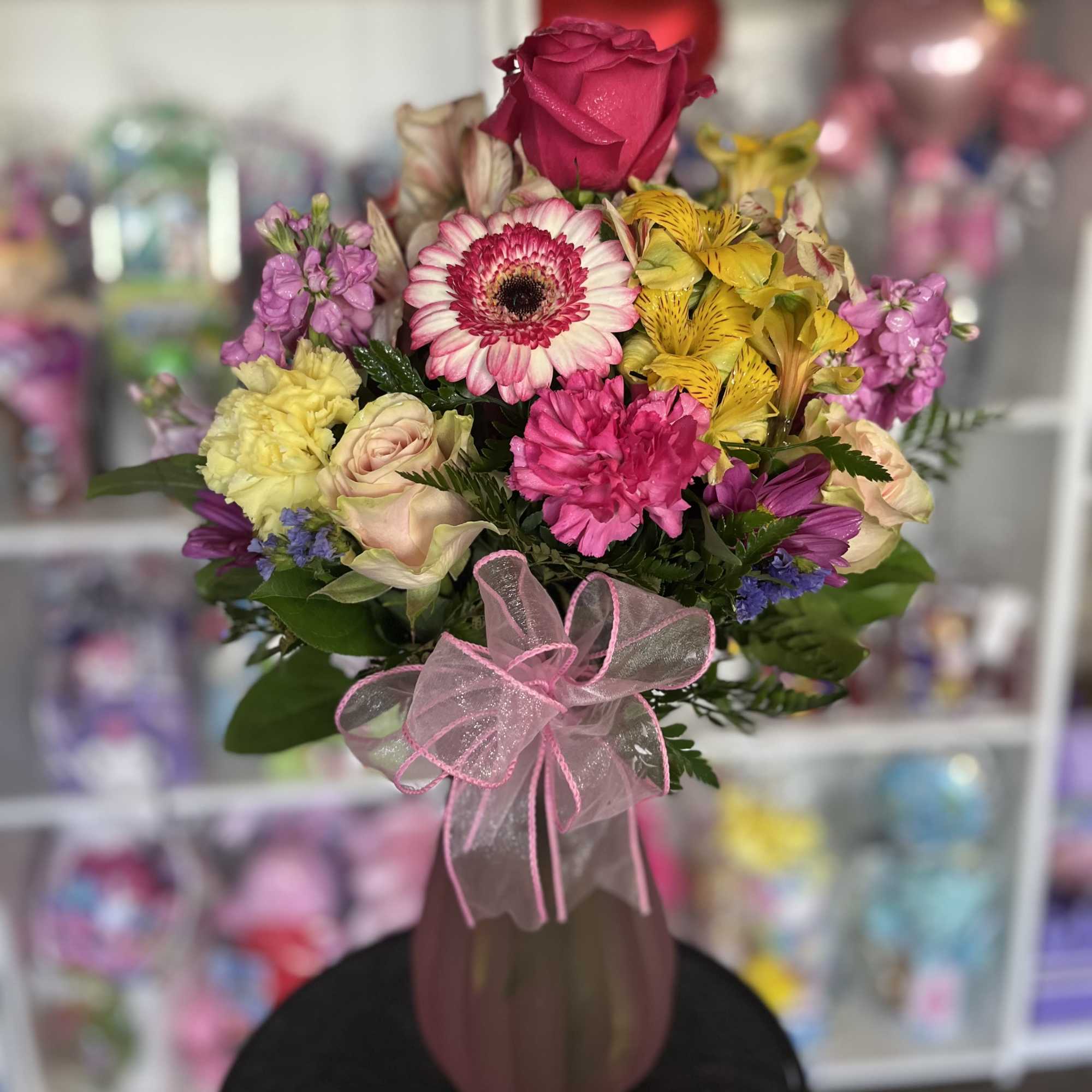fresh Colorfull  flowers in soft pink vase 