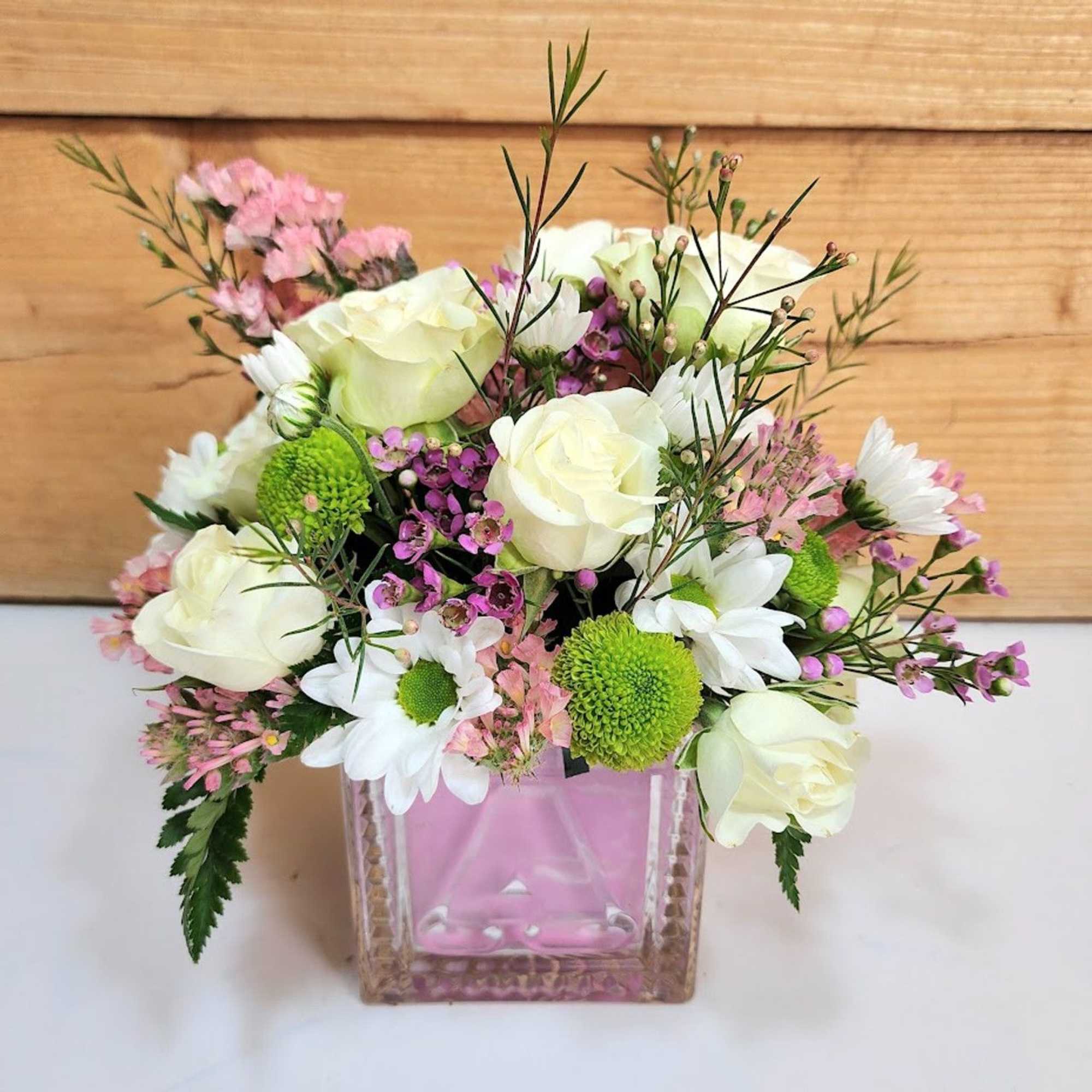 Celebrate the joy of a new baby girl with this delightful arrangement