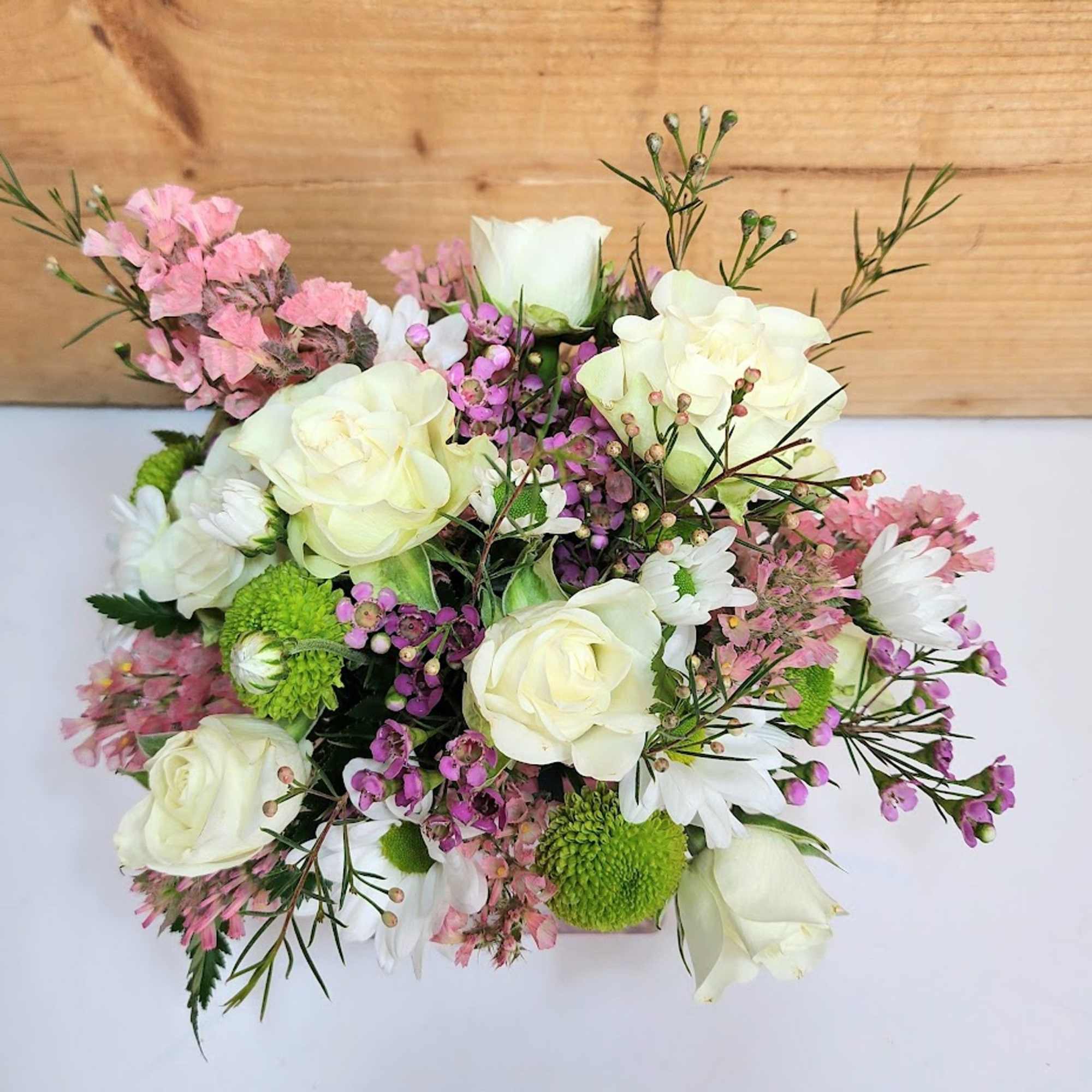 Celebrate the joy of a new baby girl with this delightful arrangement