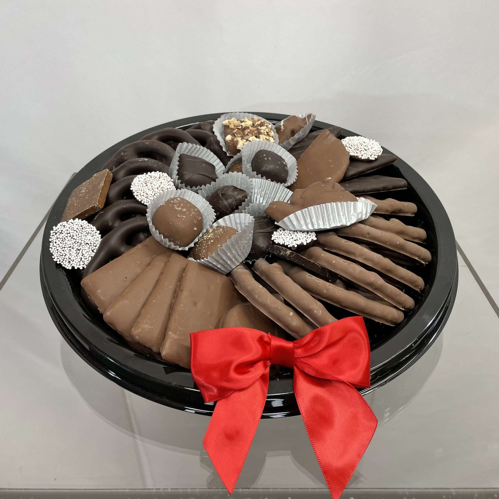 Trays have an assortment of chocolate covered pretzels, chocolate covered Oreos  Trays have an assortment of chocolate covered pretzels, chocolate covered Oreos