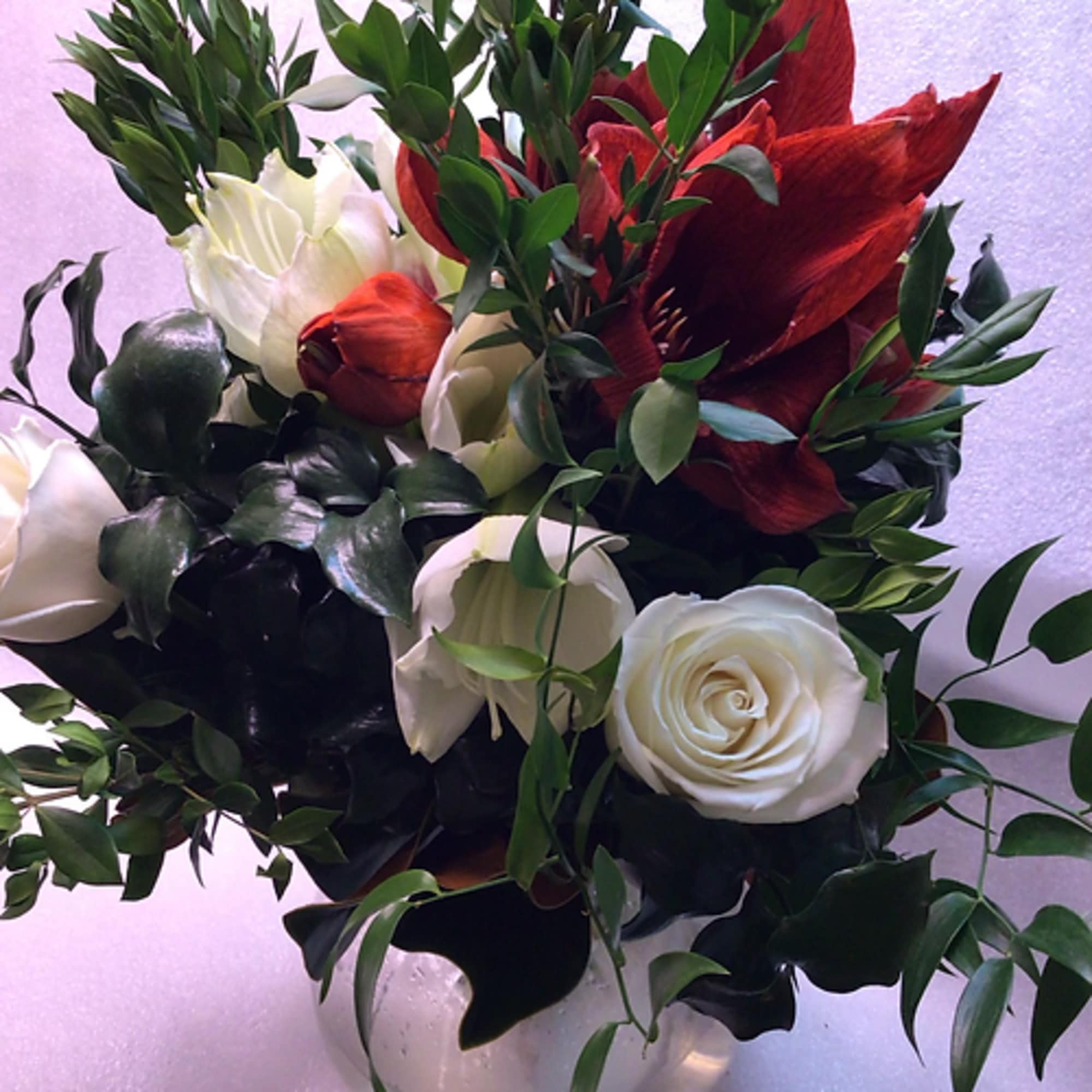 A variety of long-lasting seasonal amaryllis flowers with roses, fragrant greens and