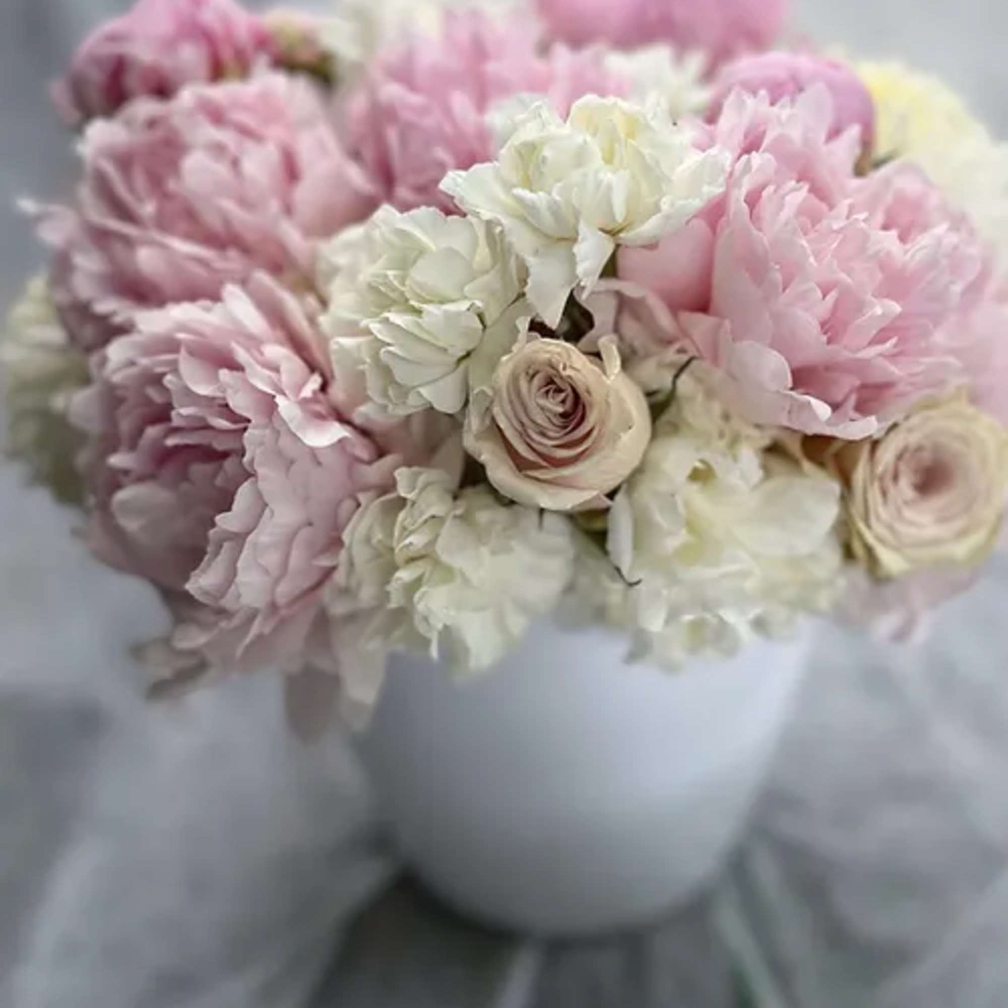 A keepsake low, wide ceramic bucket bursting with our finest selection of