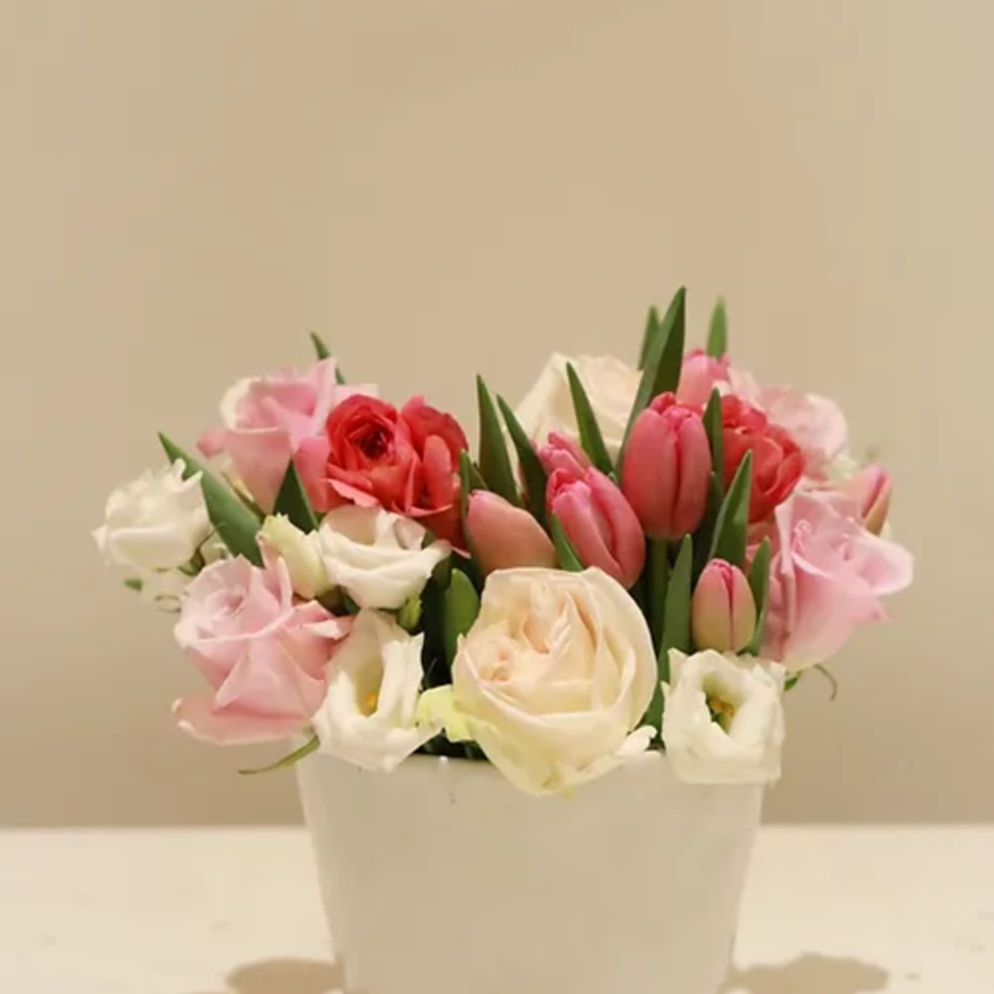 A keepsake low, wide ceramic bucket bursting with our finest selection of