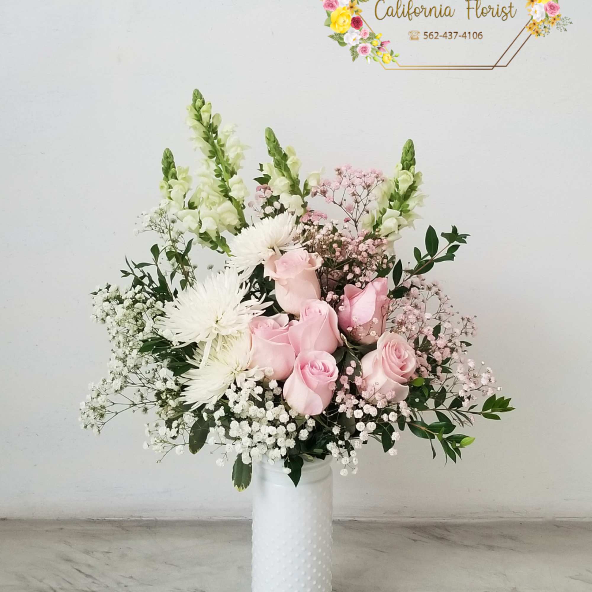 Beautiful pink roses and white Fuji spider mums, fresh snapdragons, delicate clouds