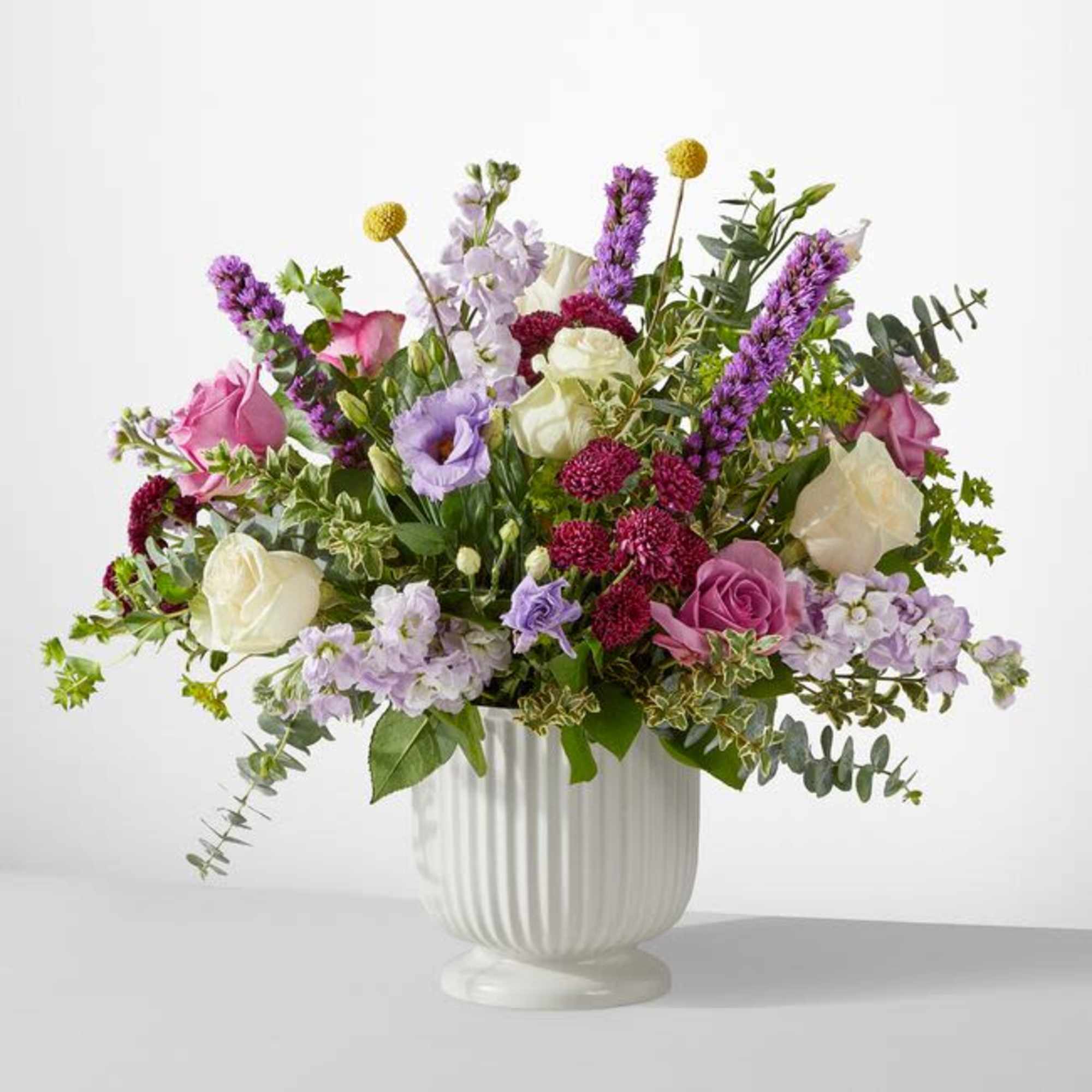 A true work of art, this grand bouquet of purple, lavender and